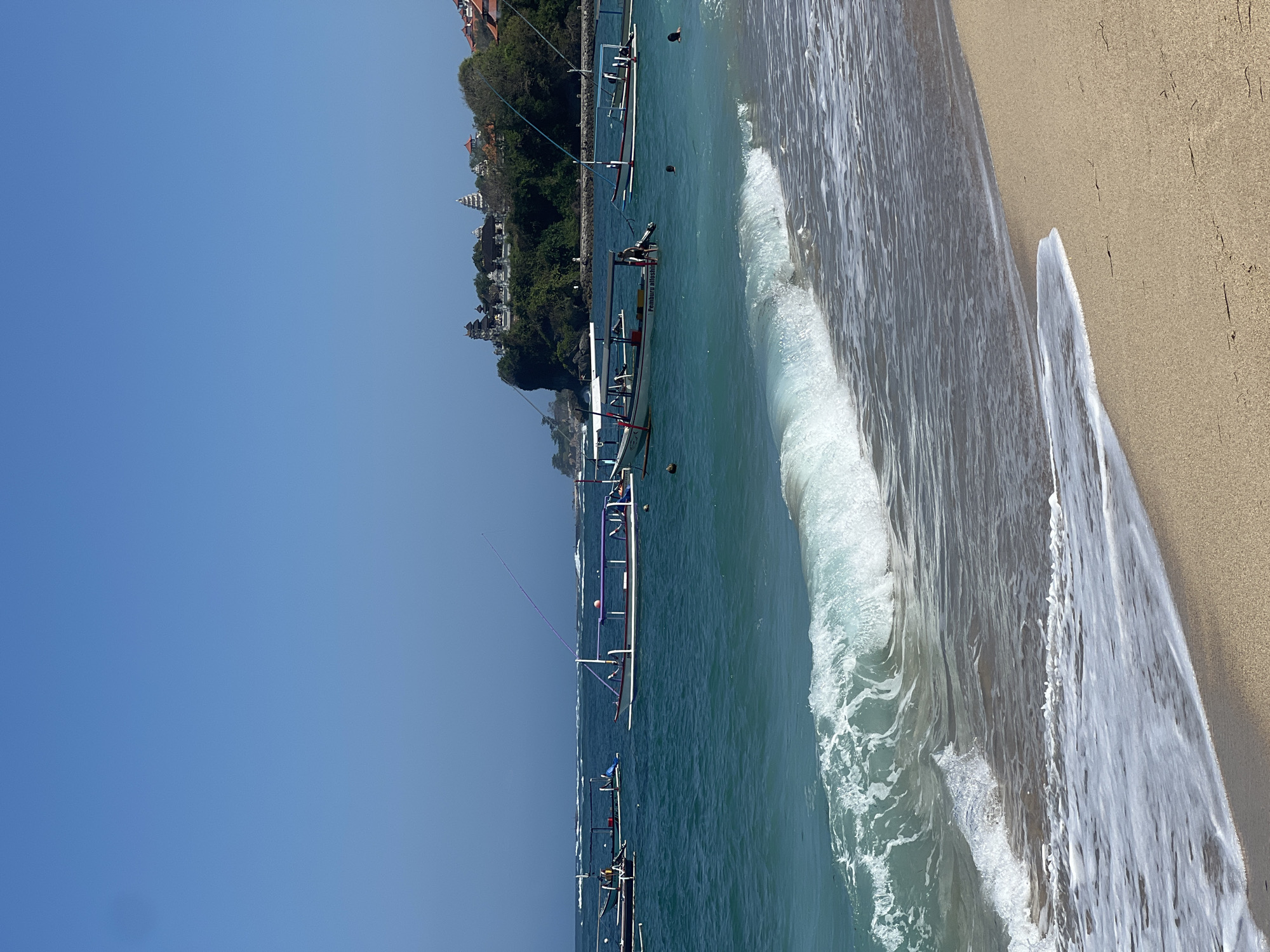 Relaxed beach morning at Kuta Selatan with coastal temple views