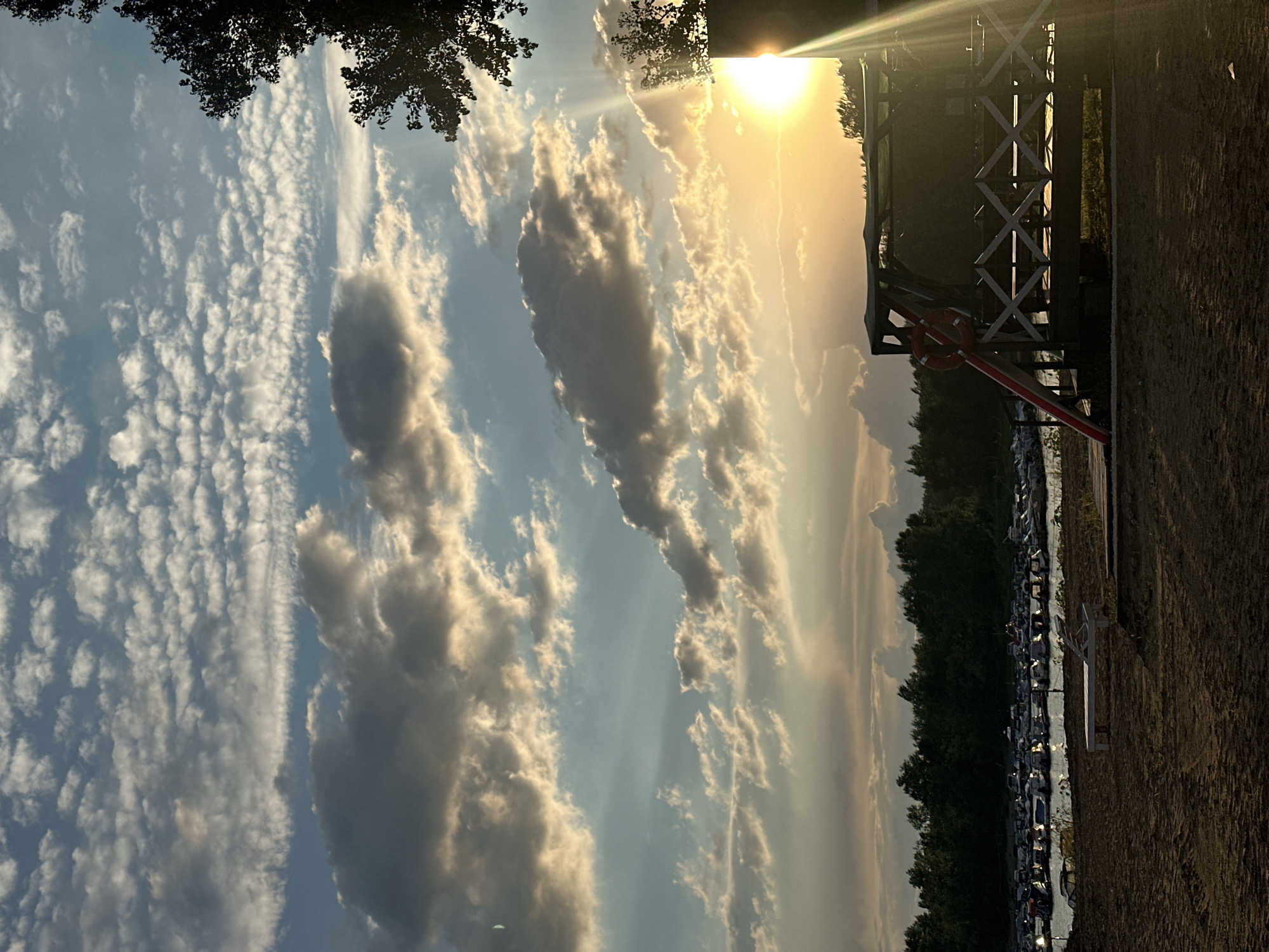 Sunset at the Volga: marina, sandy beach, wooden swings
