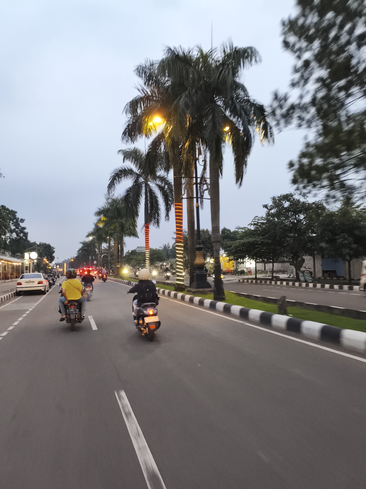 Evening street activity observed in Cibinong, Indonesia