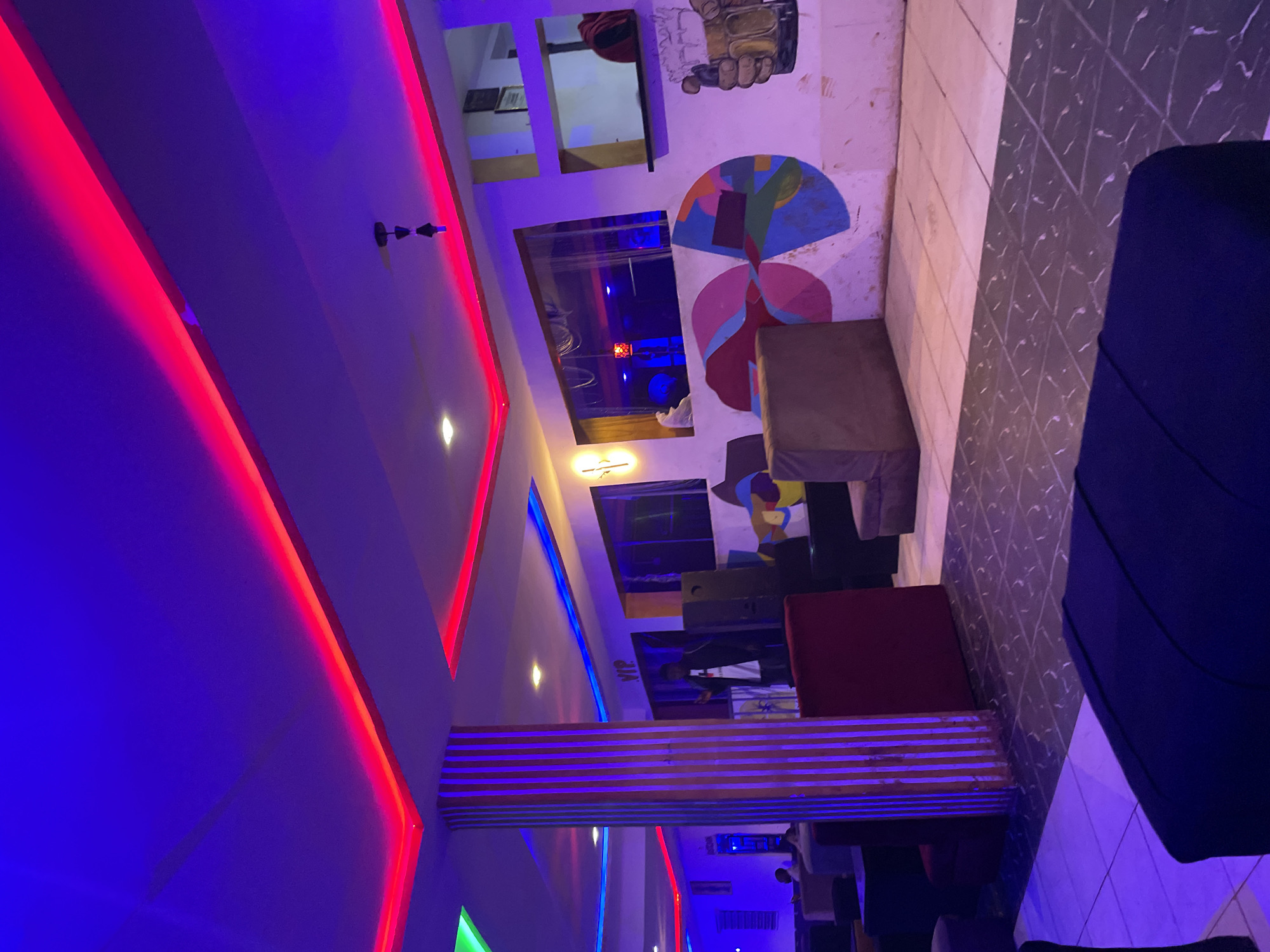 Late-night hookah lounge session under neon lights in Durumi