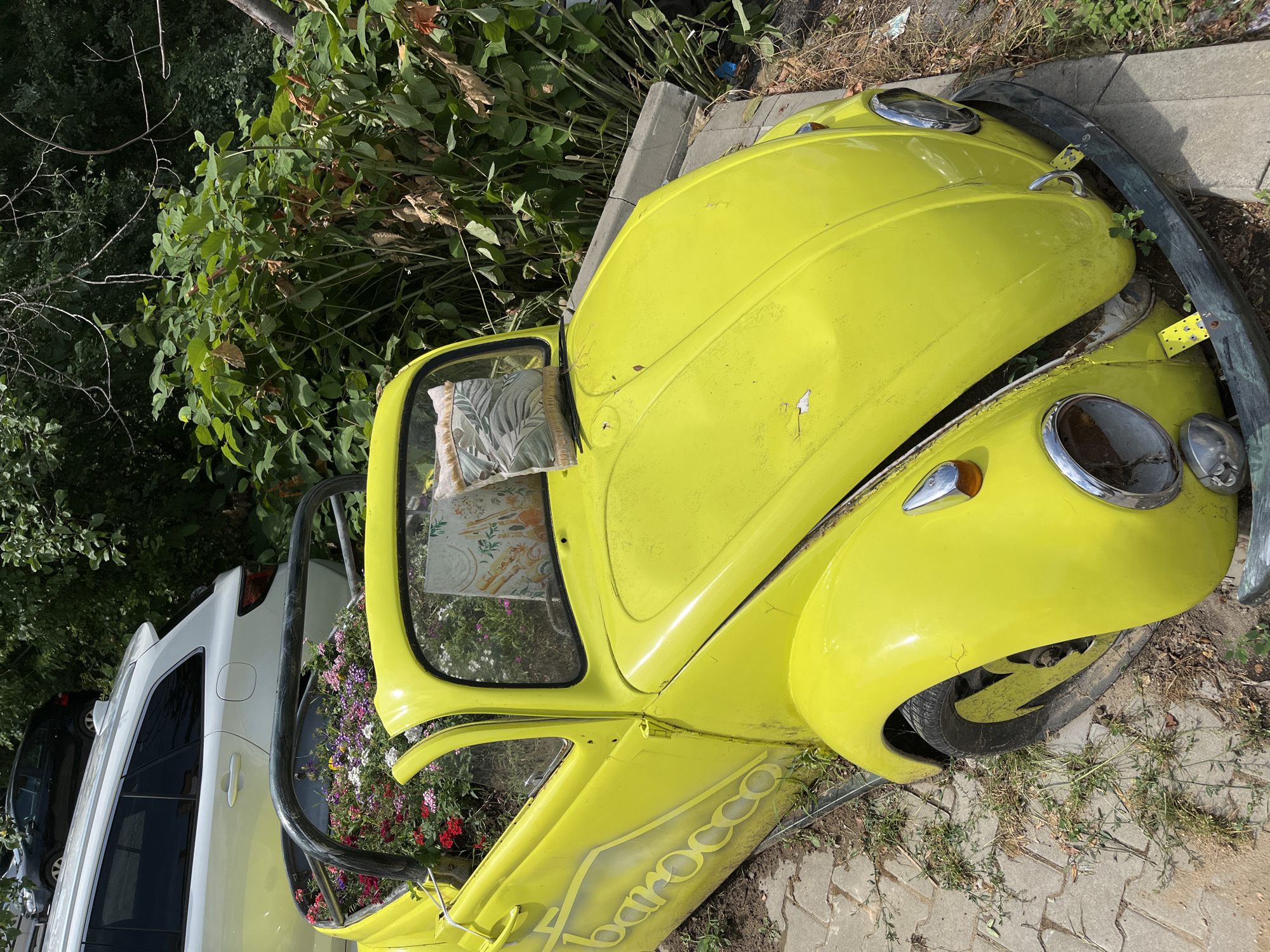 Retired yellow Beetle becomes a planter on a Sofia street