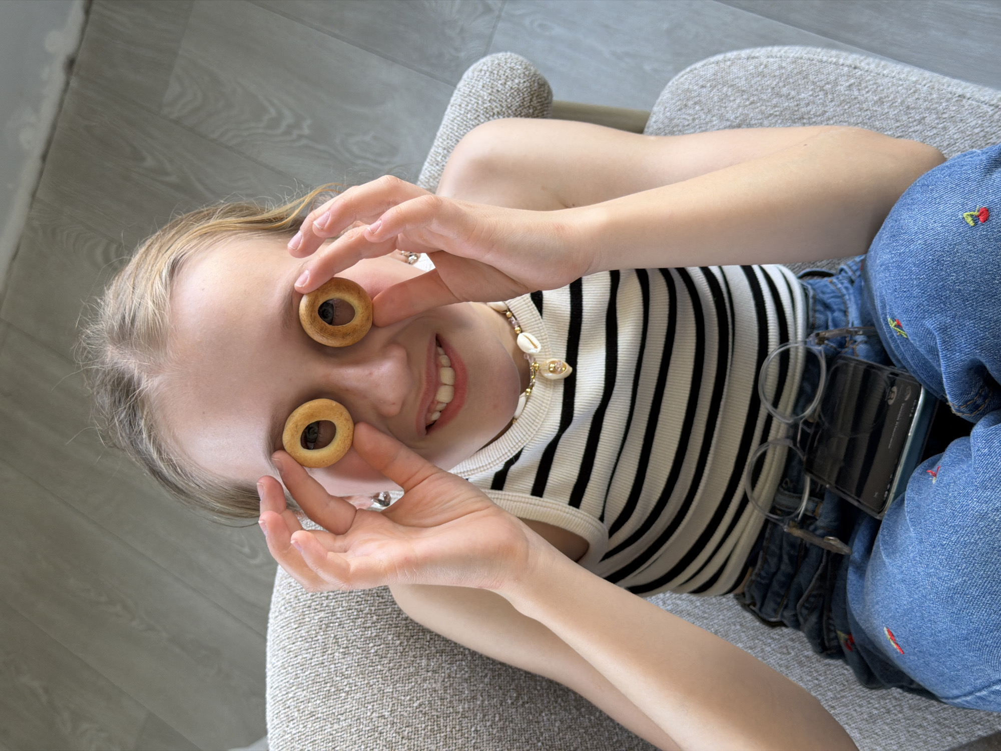 Young person enjoys cookies on furniture in Dreiliņi