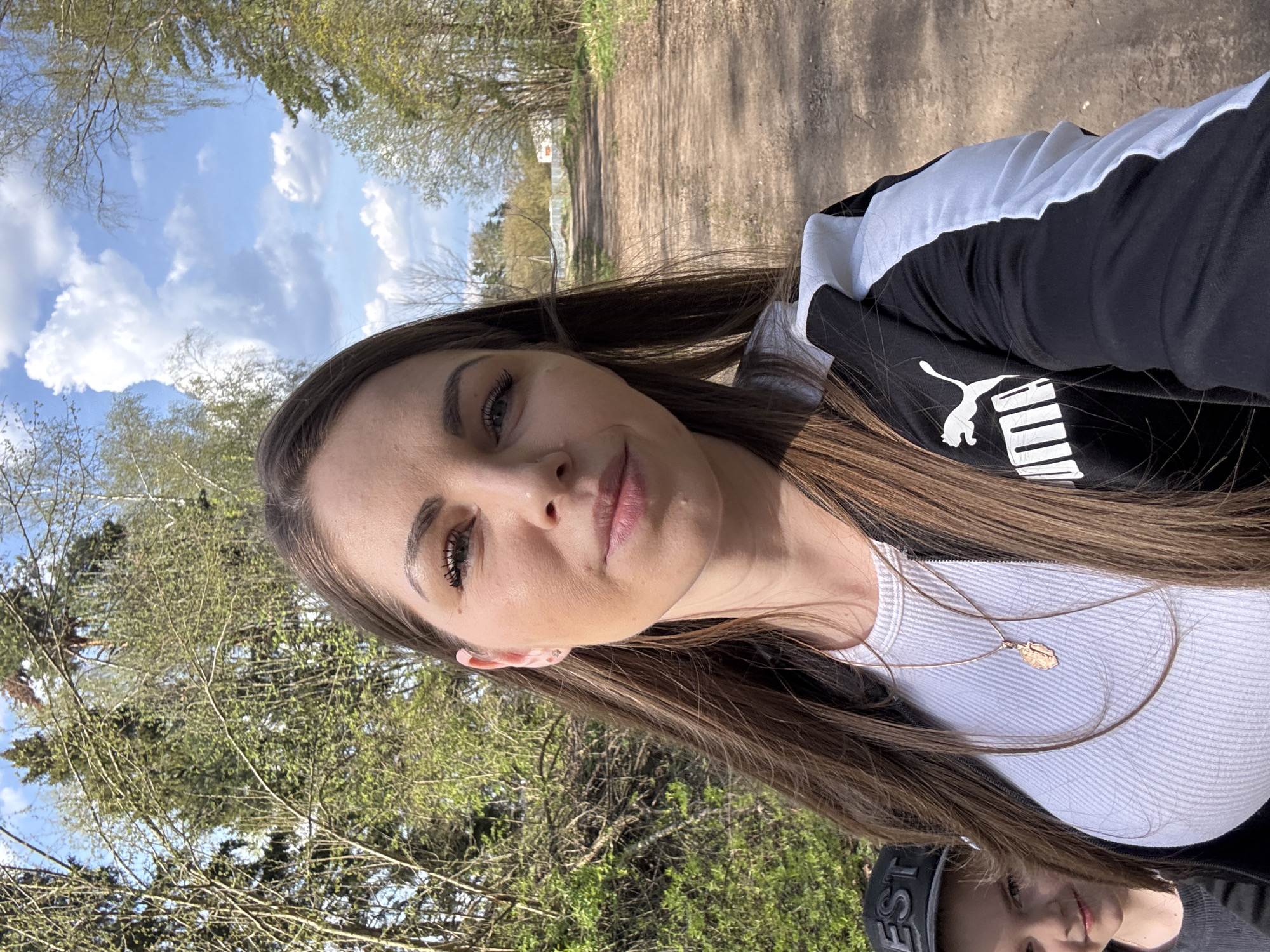 Woman conducts outdoor photo session in rural Russian village