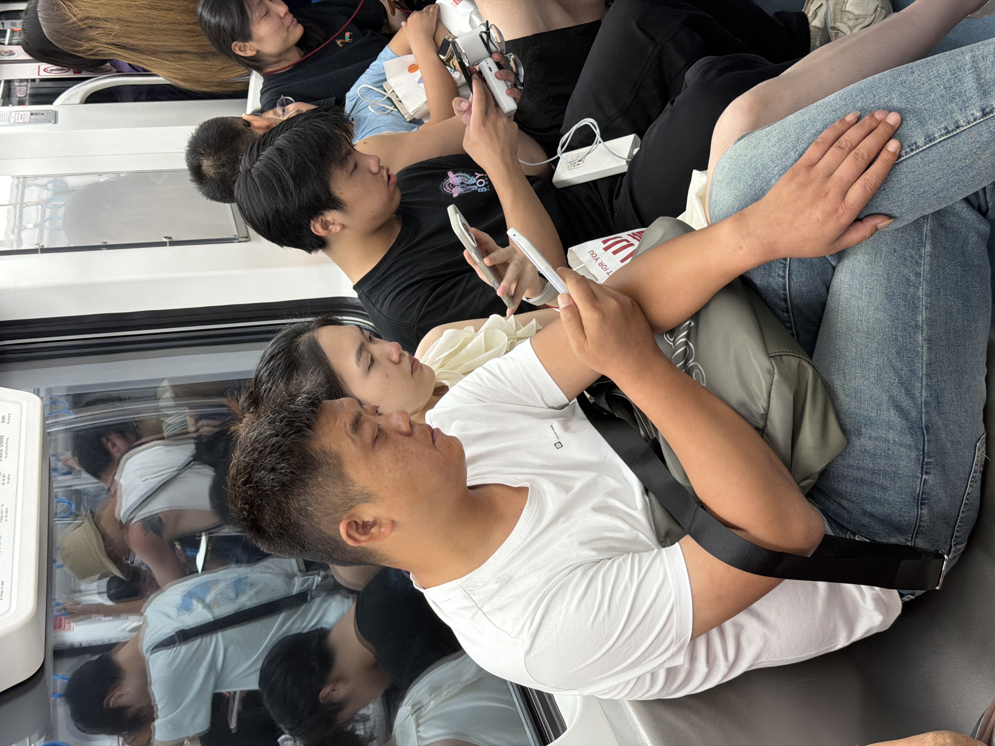 Crowded subway car documented by passengers during morning commute