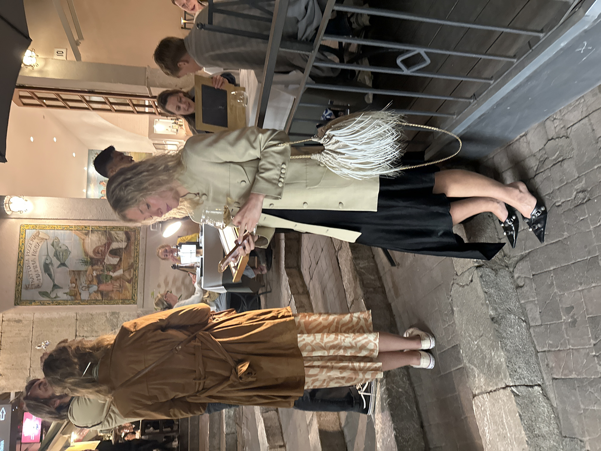 Evening dining scene captured in Taormina, Italy