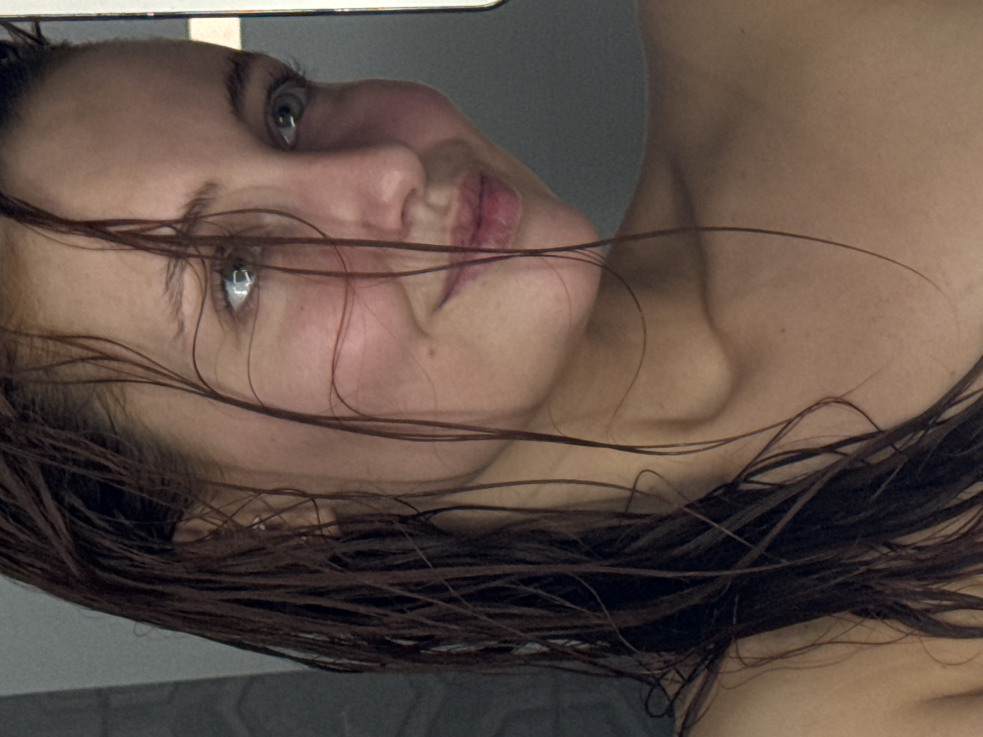 Woman photographed in bathroom setting in Chaikovsky, Russia