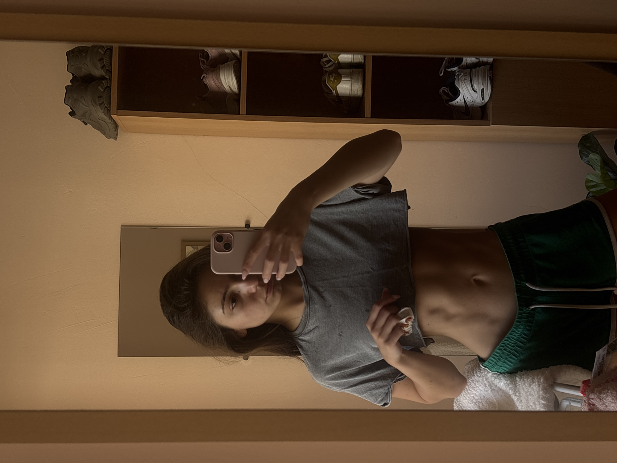 Mirror selfie in a Varna bedroom, athletic wear