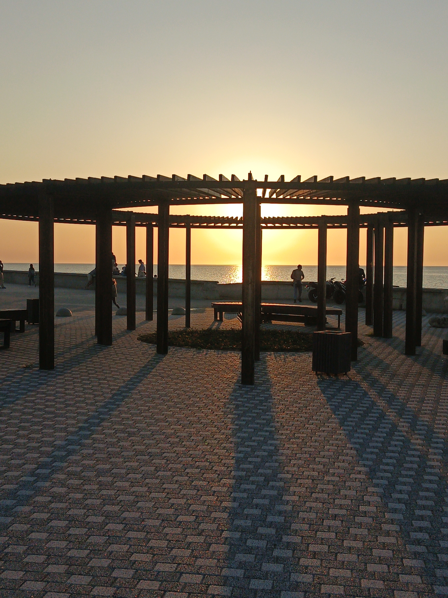 Sunset moments captured along Sevastopol's seaside promenade during golden hour