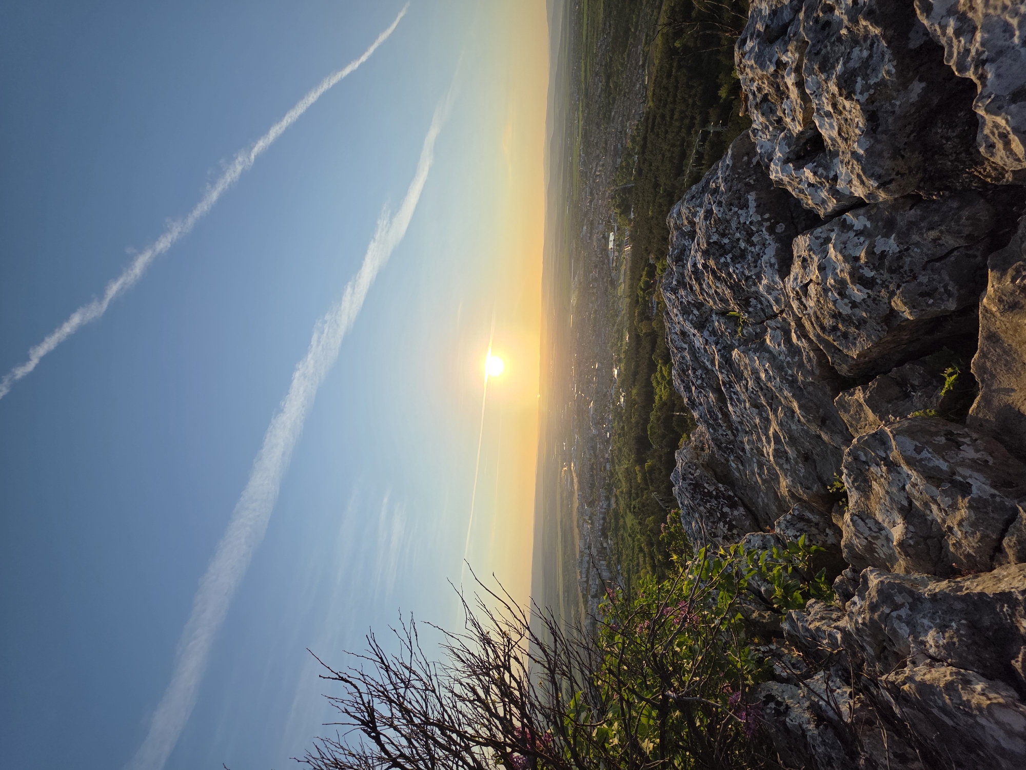 Golden hour landscape captured from rocky clifftop vantage point