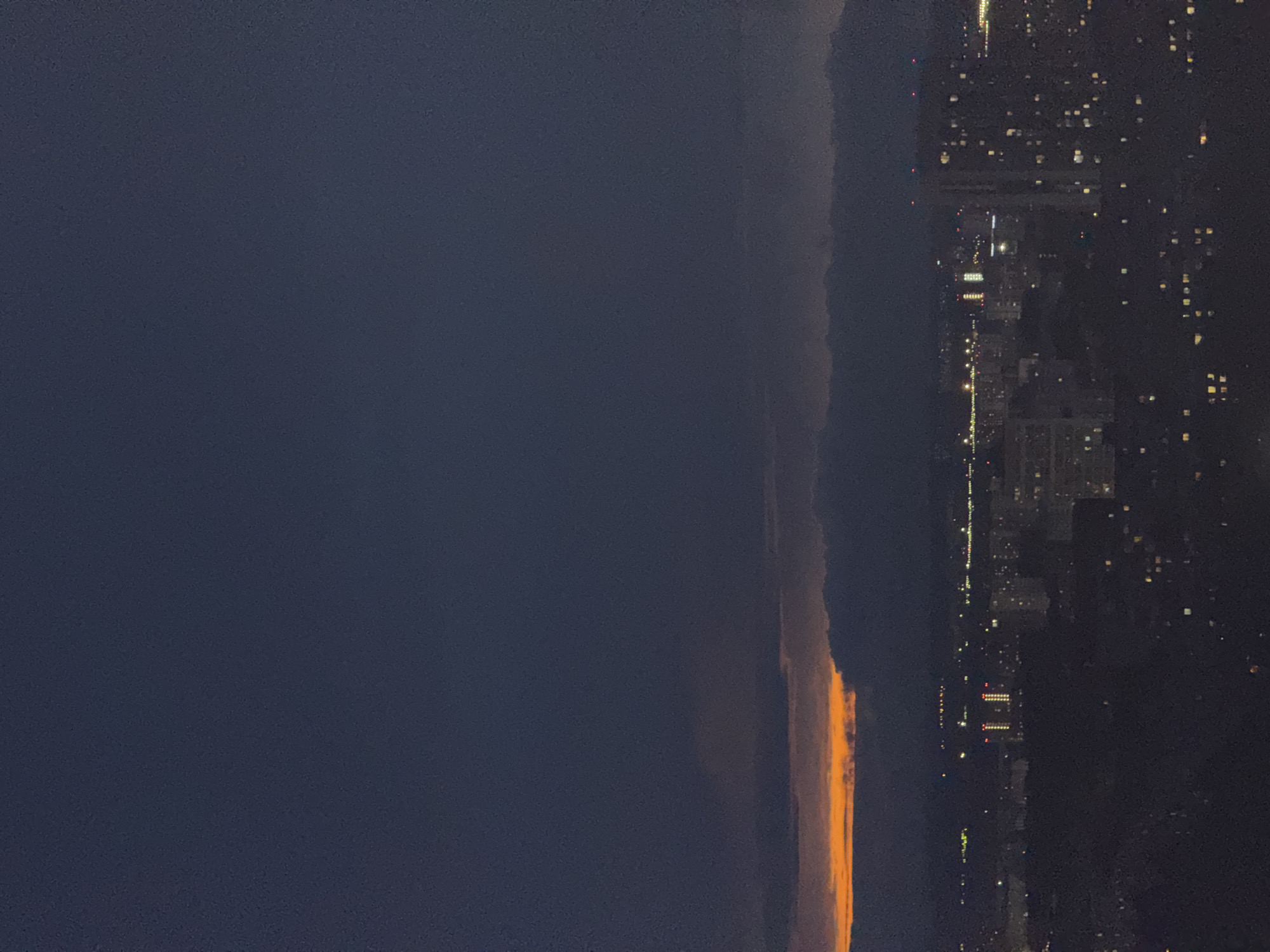 Orange glow illuminates horizon over Гамово, Russia at night