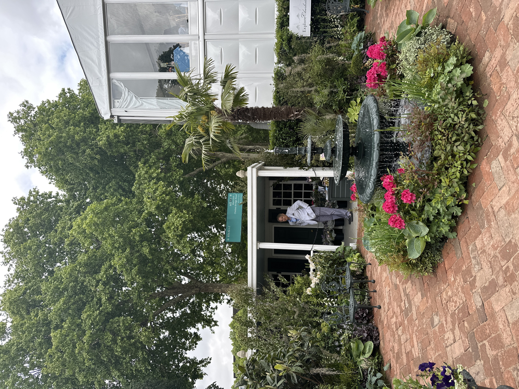 London garden scene with fountain, gazebo captured by witness