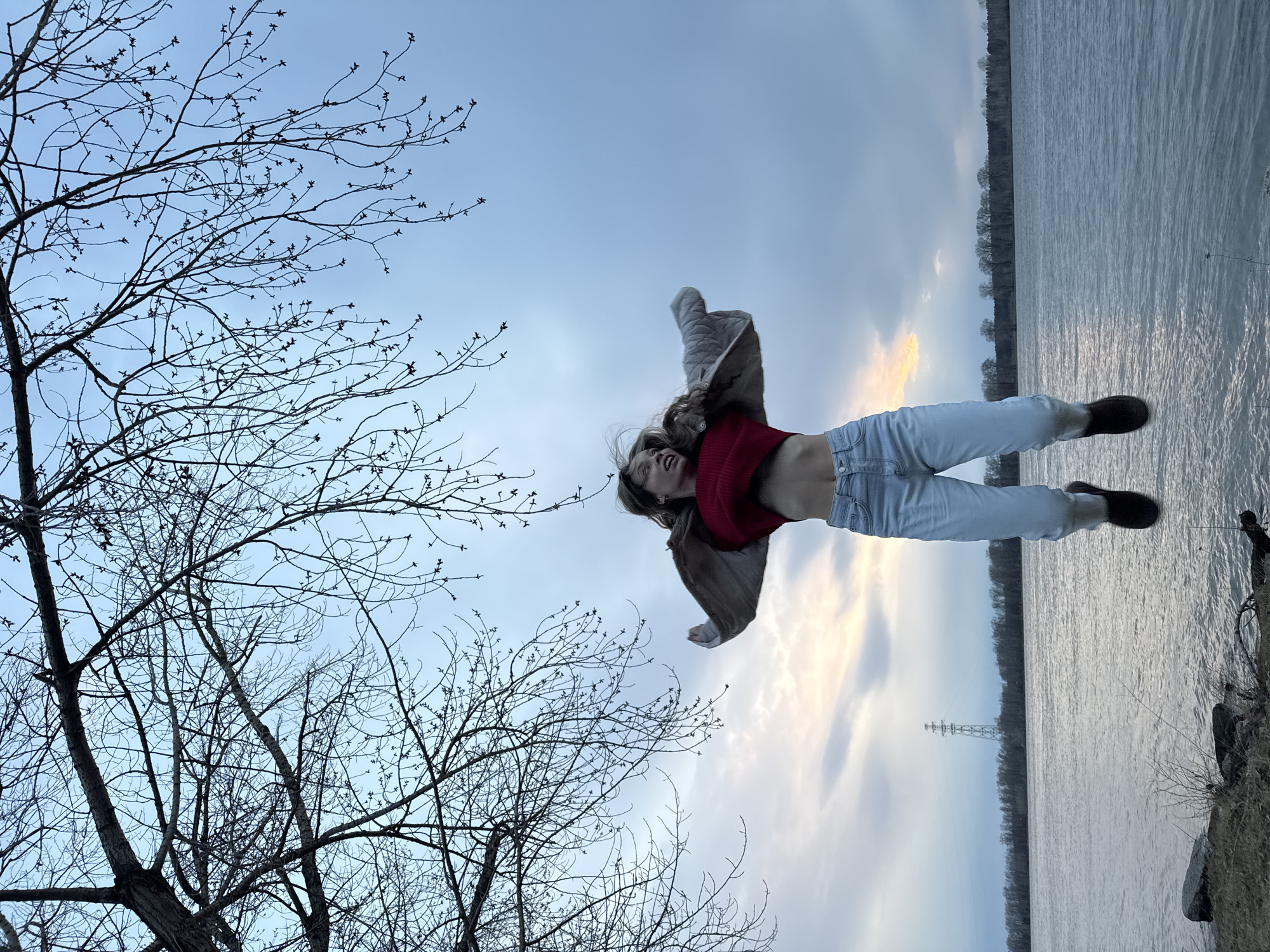 Young person captured mid-air at sunset in Chaikovsky, Russia