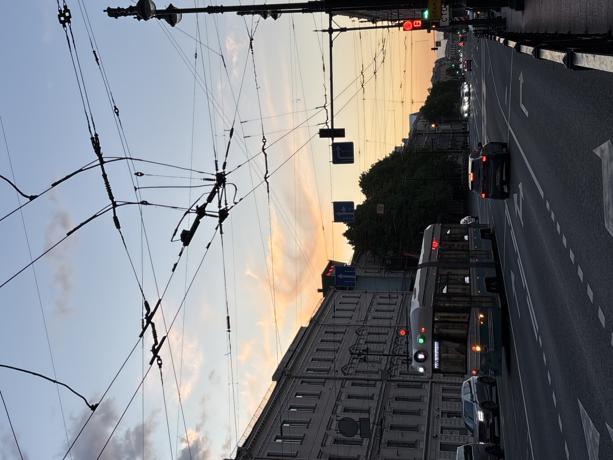 Twilight street scene documented in Saint Petersburg showing trolleybus infrastructure