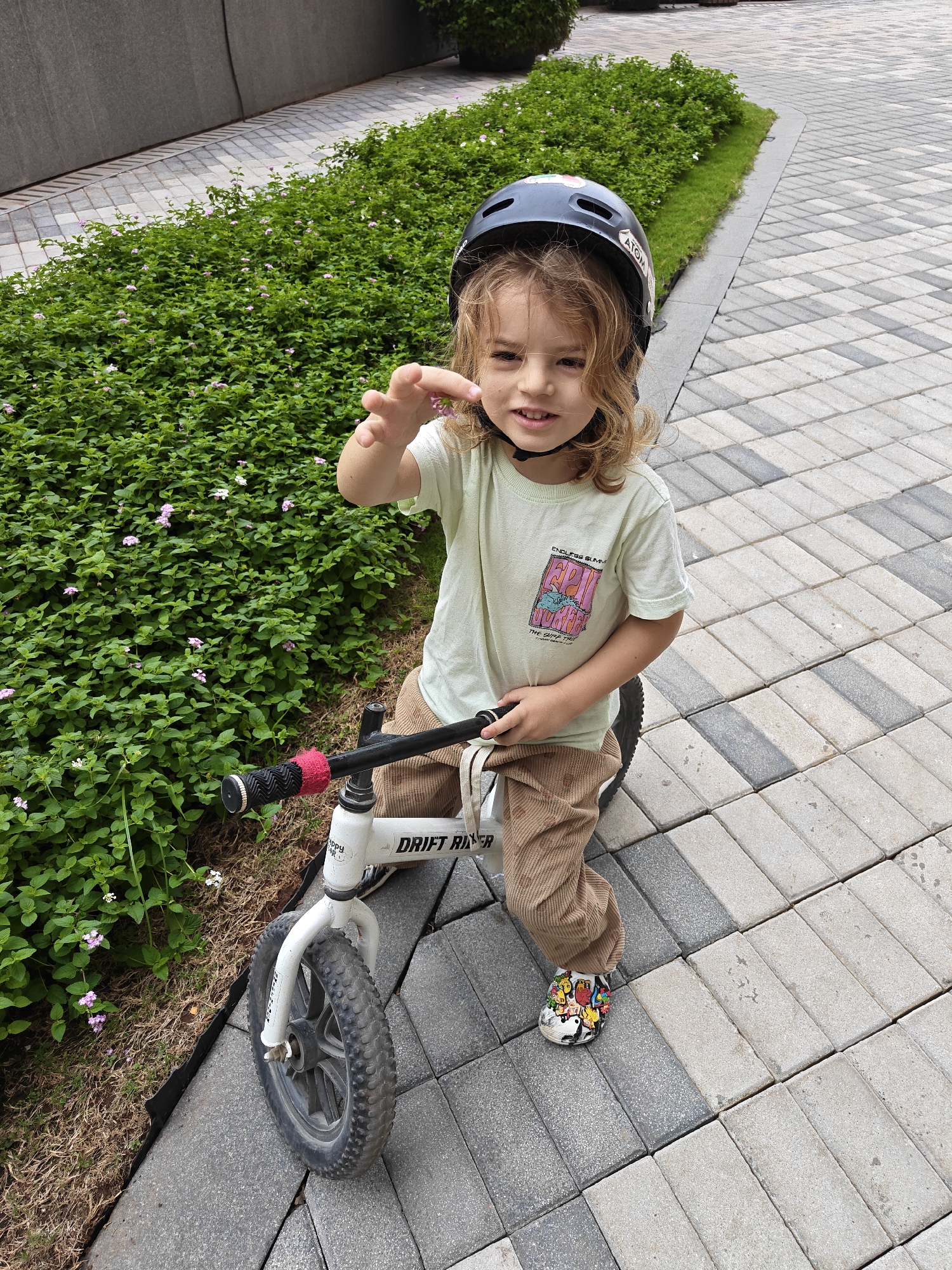Child rides balance bike in Mumbai morning