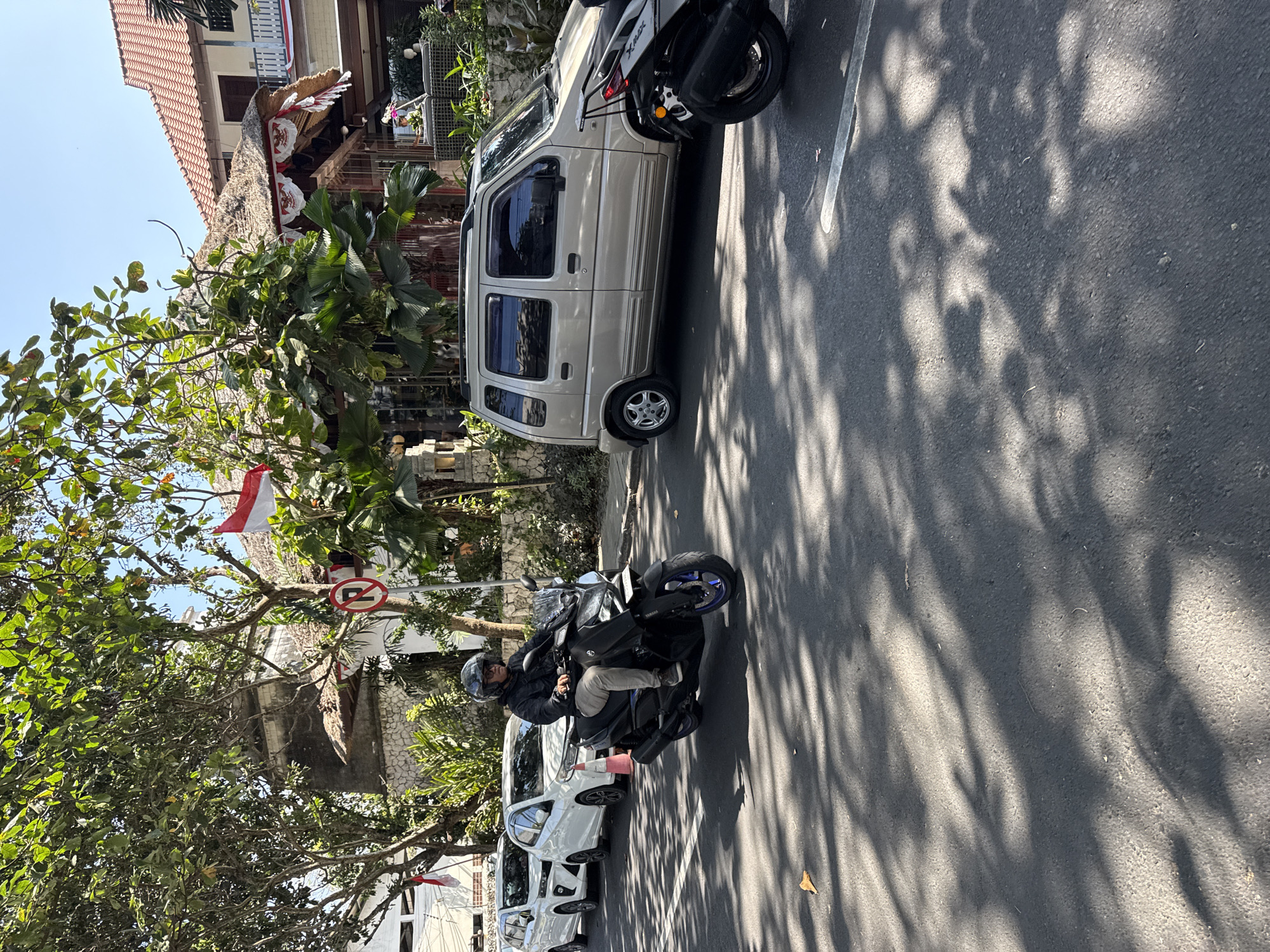 Everyday street life and beach gear in Denpasar, Bali