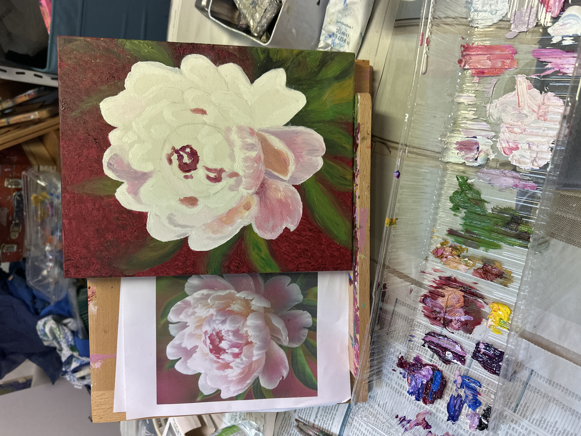 Artist paints peonies, Milan street life documented Monday morning