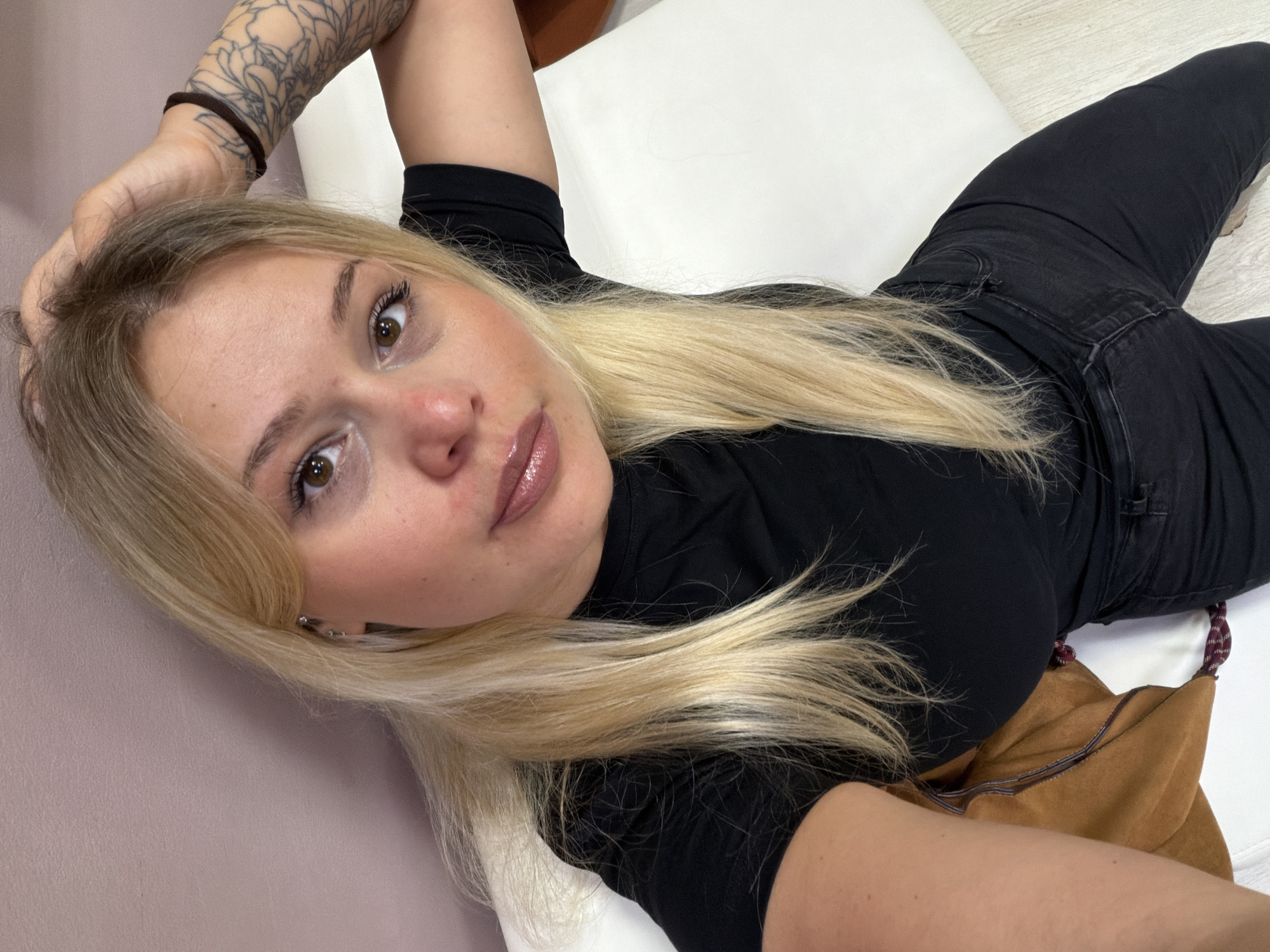Woman takes selfies at hair salon in Sarapul, Russia