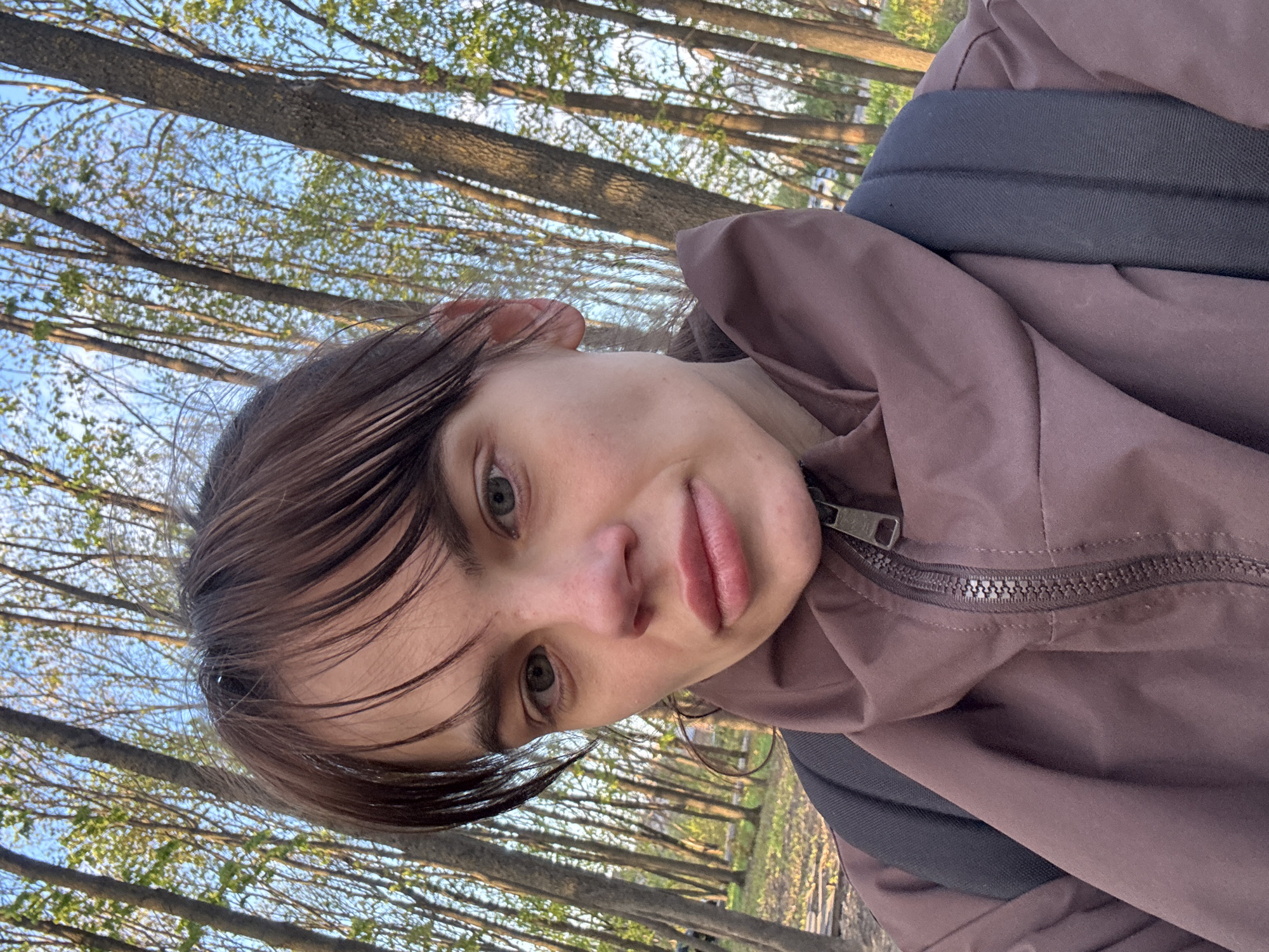 Young woman documents afternoon park visit in Rostov-on-Don