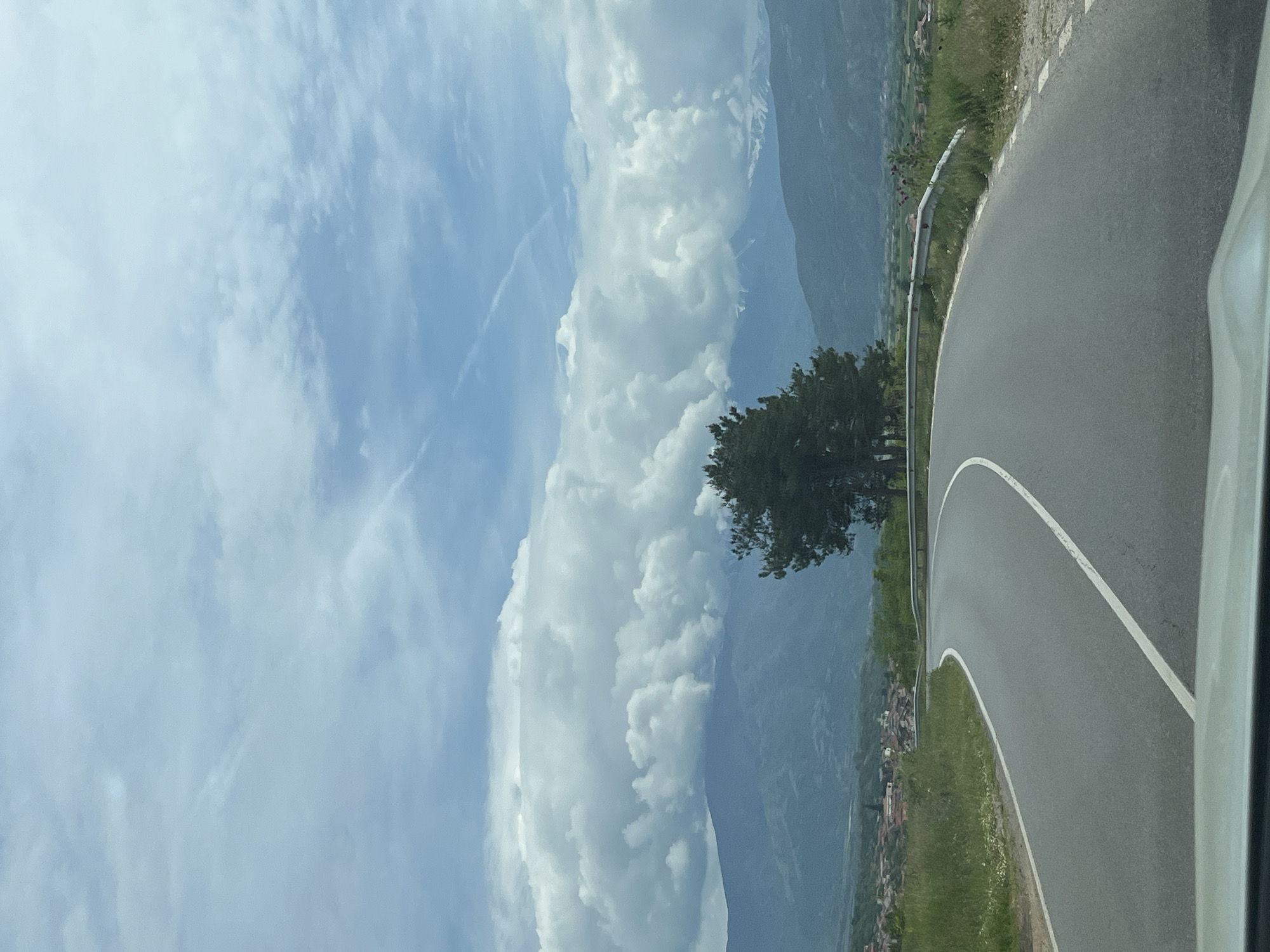Vehicle travels winding road through Kocherinovo, Bulgaria