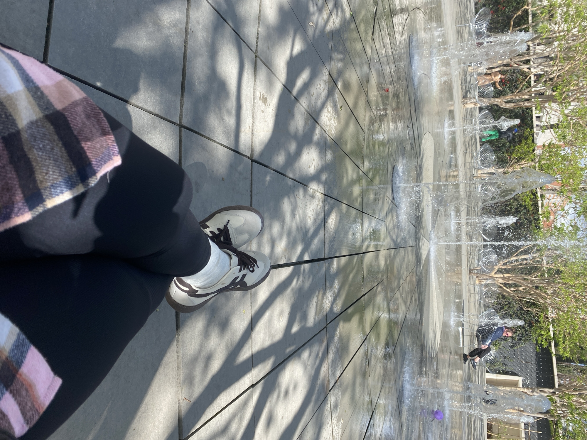 Person takes morning selfies by fountain in Krasnodar