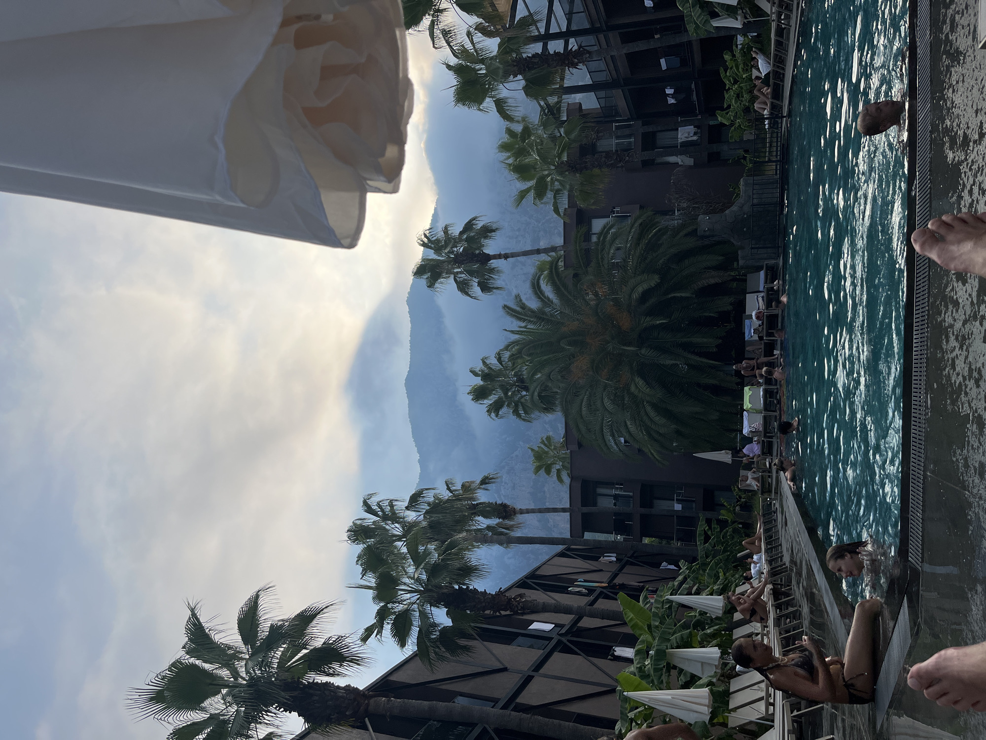 Poolside afternoon at a mountain-backdrop resort