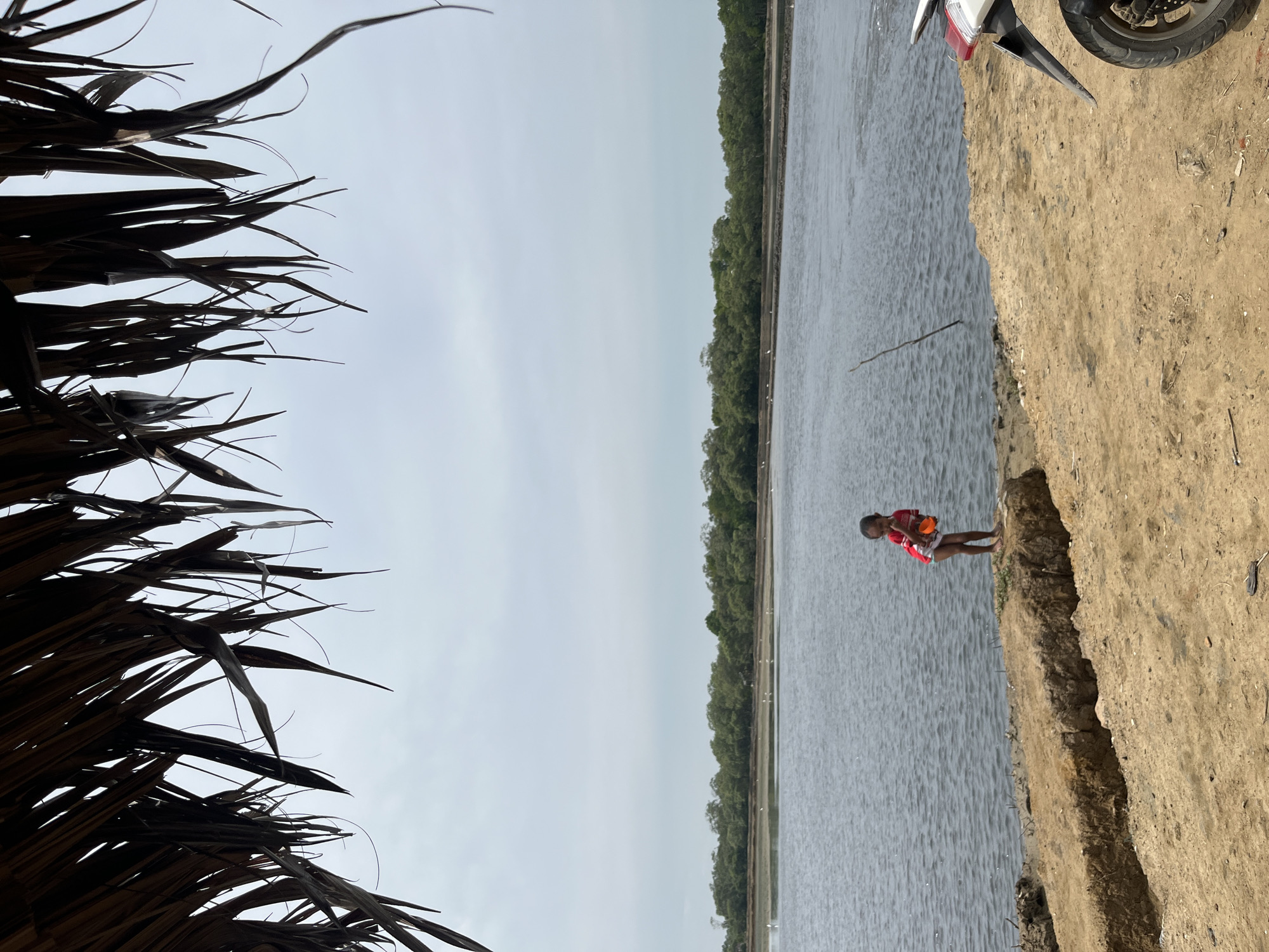 Under a thatched roof, looking out at the Dayahtuha coast.