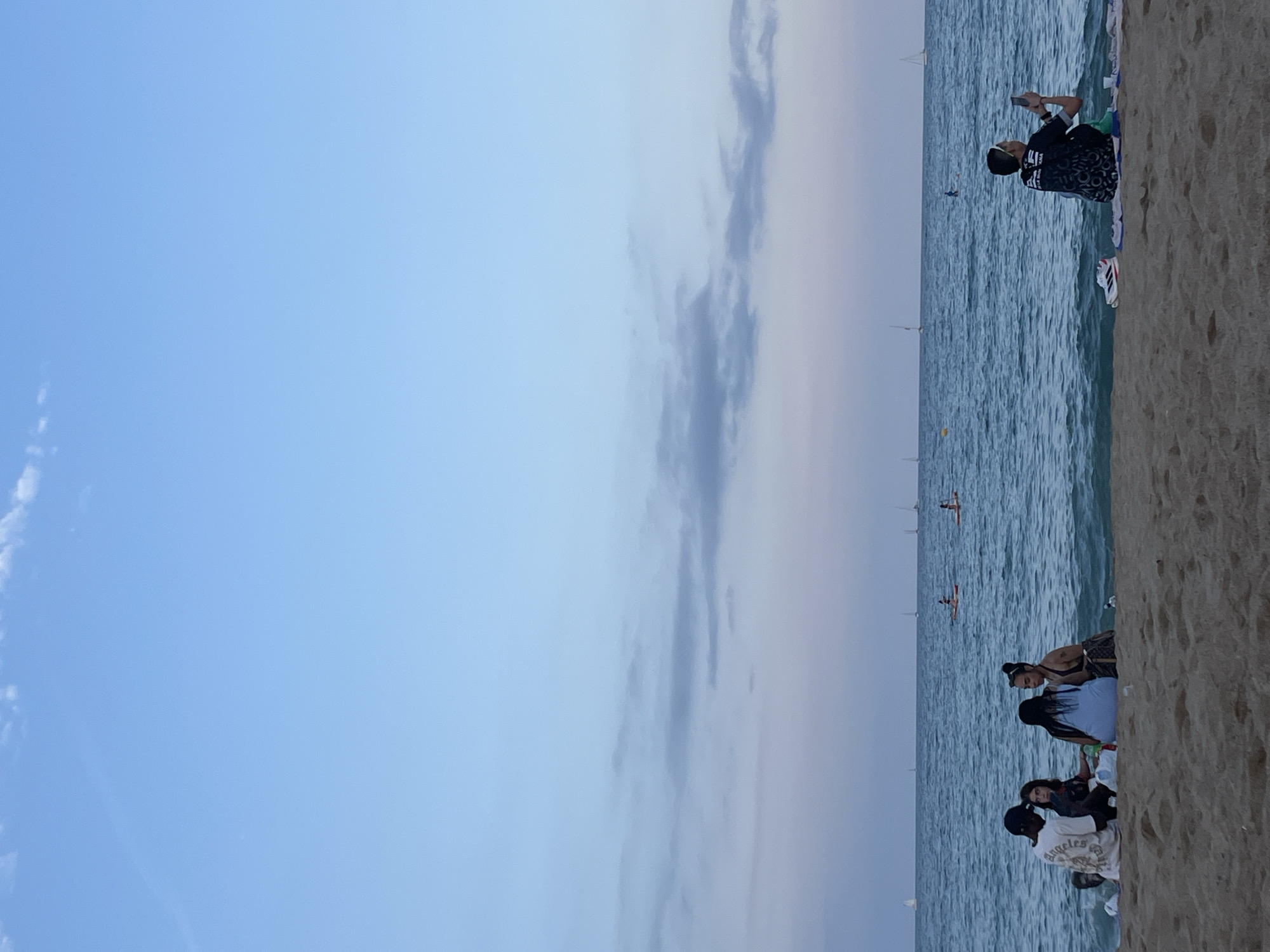 Evening beach leisure activities captured across Barcelona coastline