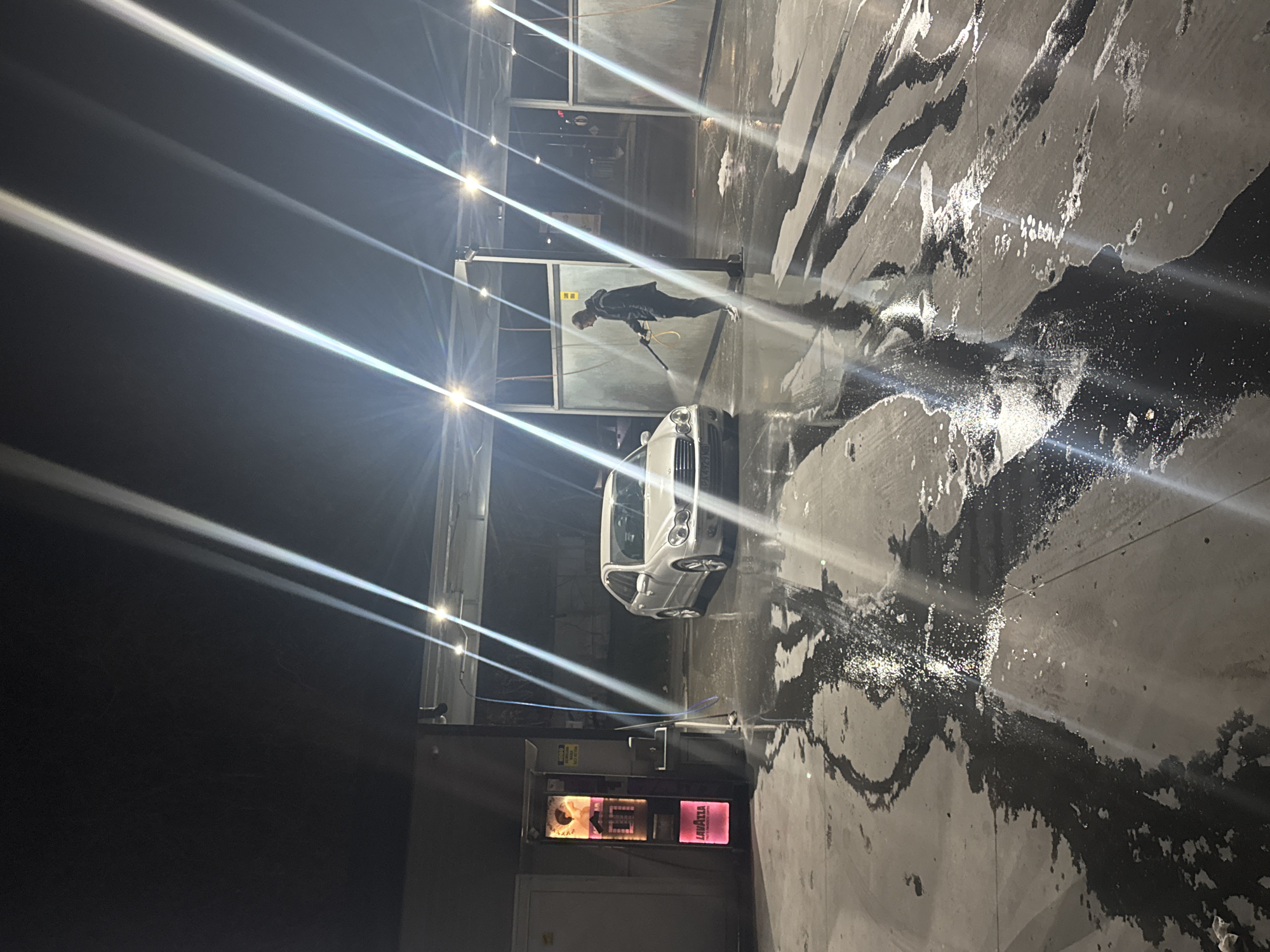 Man washes Mercedes at car wash in Plovdiv, Bulgaria