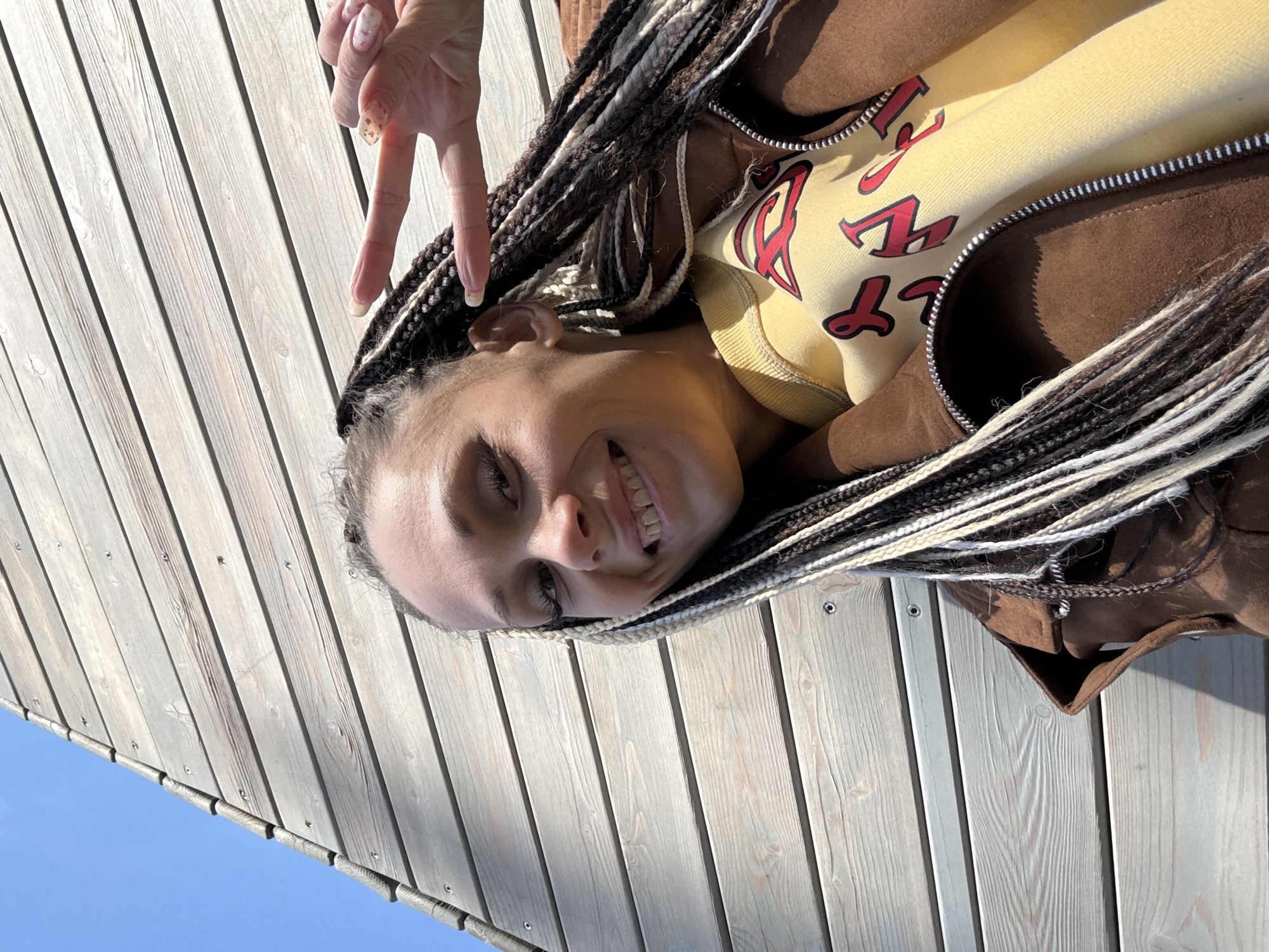 Woman poses for photo on sunny day in Rusanovo