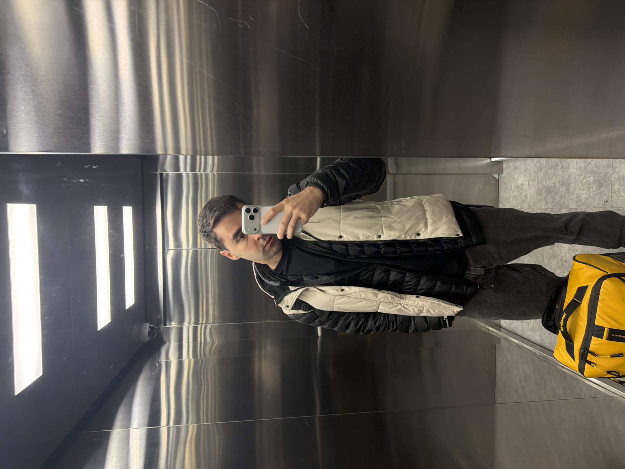 Person Takes Mirror Selfie in Tbilisi Elevator