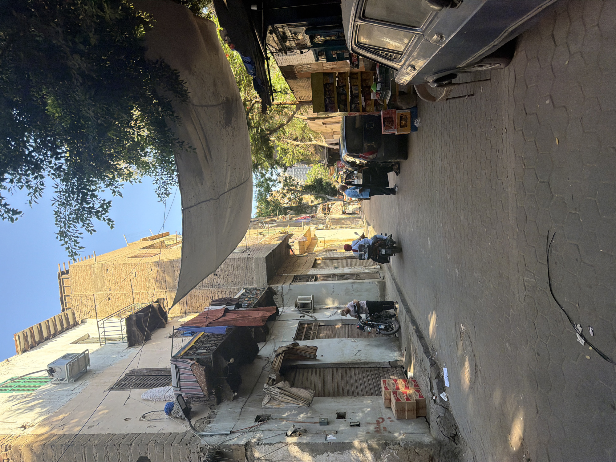 Sunlit cobblestone alley in Cairo's historic district
