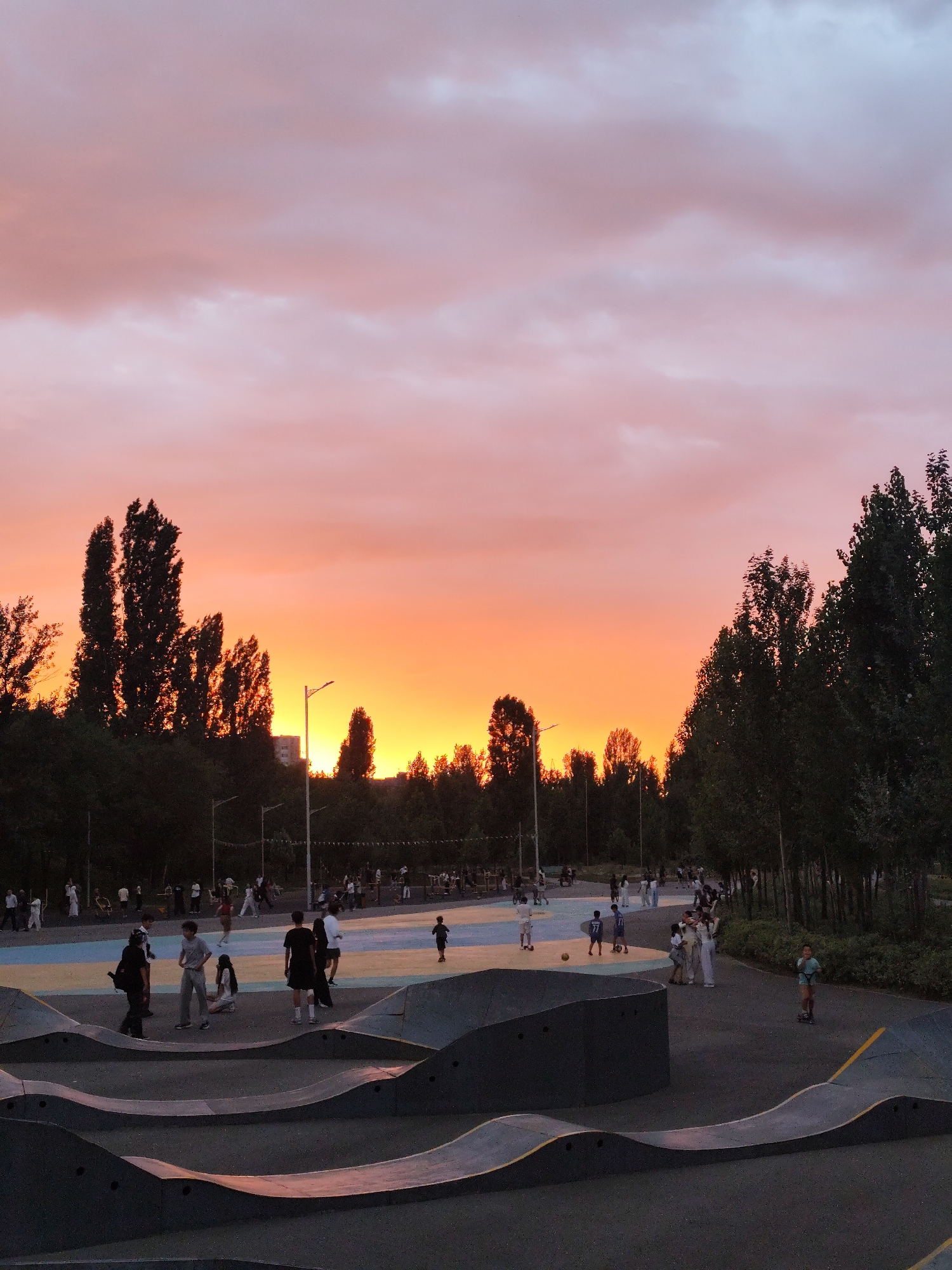 Sunset over an Almaty skate park, July 2026