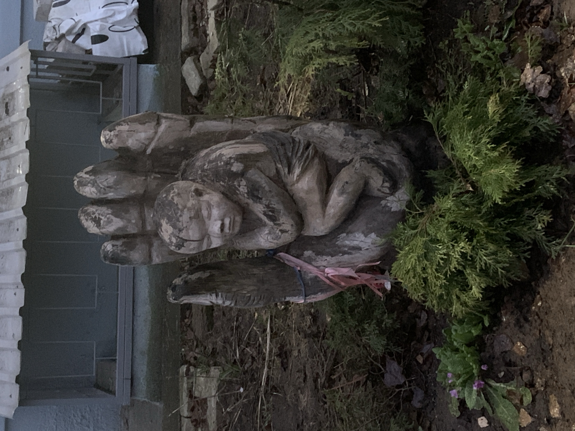 Wooden hand-child sculpture spotted in Chaikovsky garden