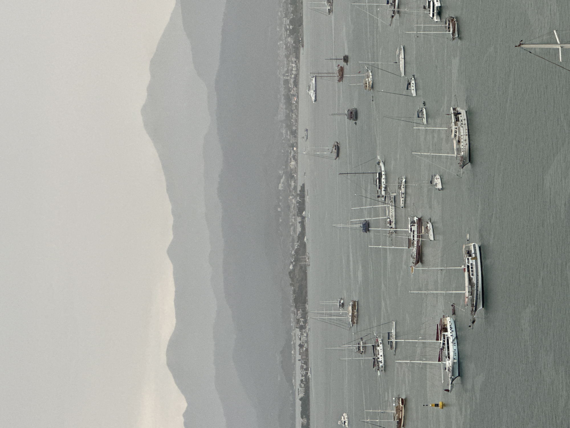 Fethiye marina packed with sailboats under overcast skies