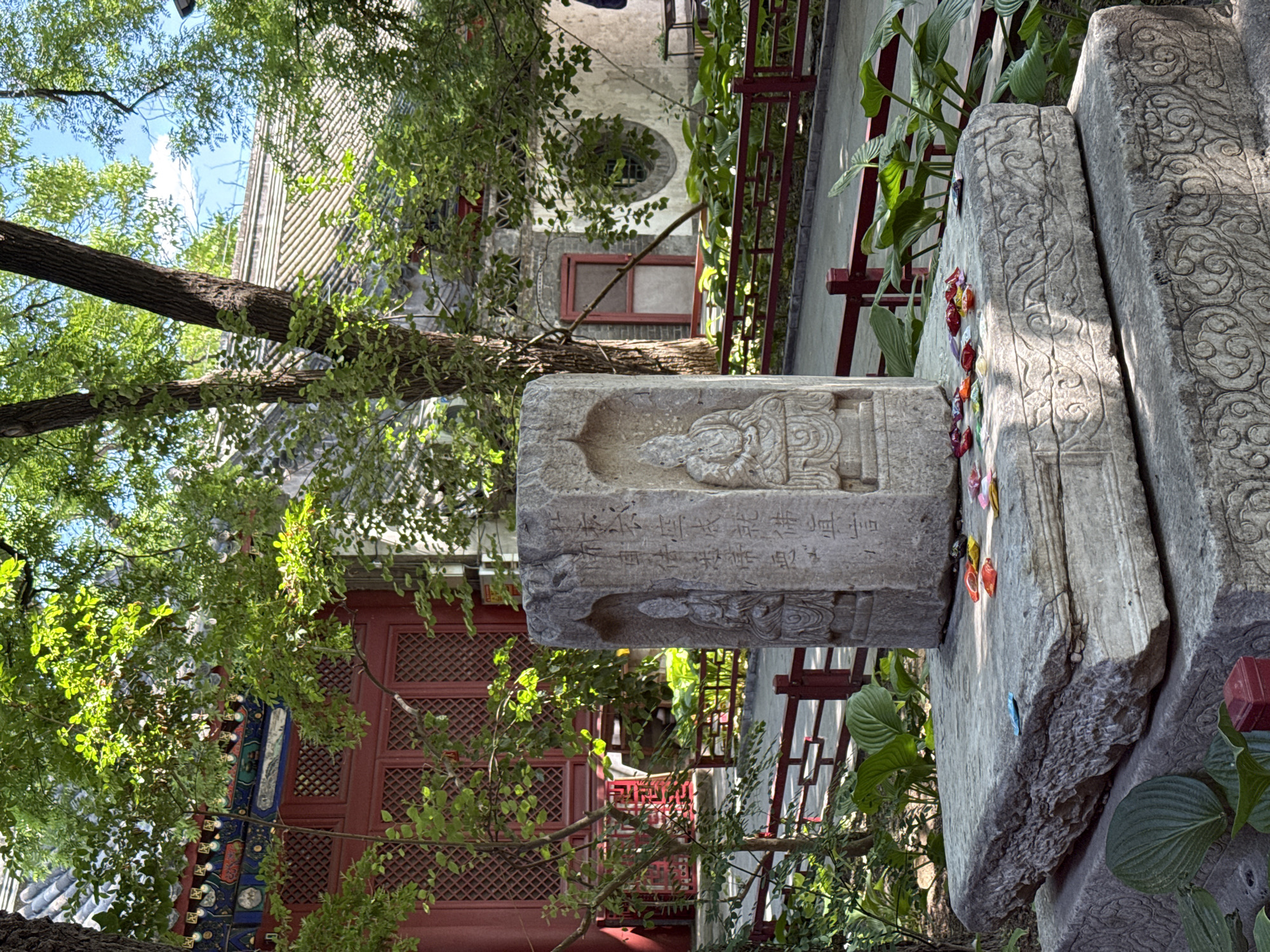 Stone monument with carvings documented at outdoor historical site