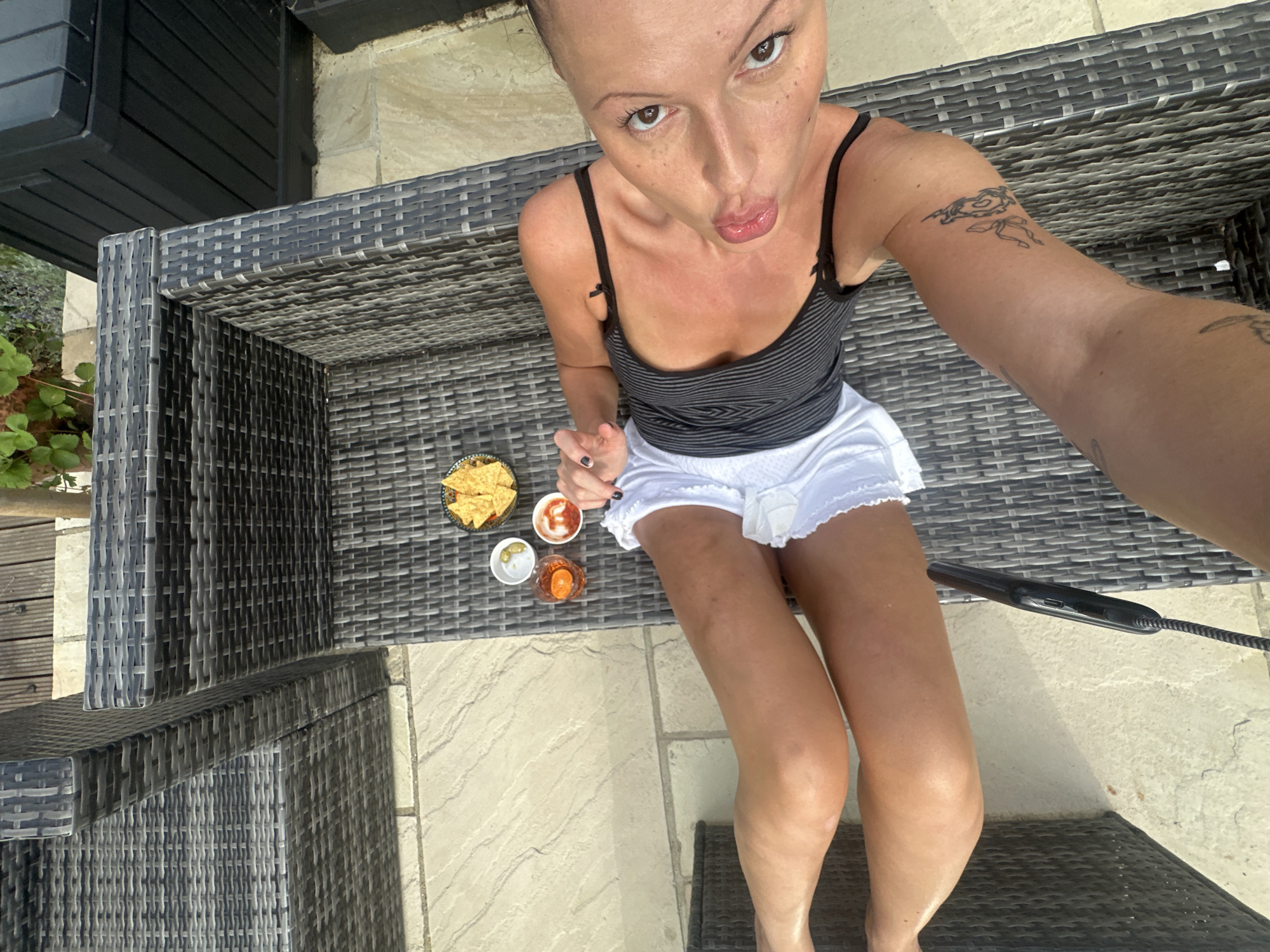 Relaxing at an outdoor table in Tunbridge Wells with drinks and snacks