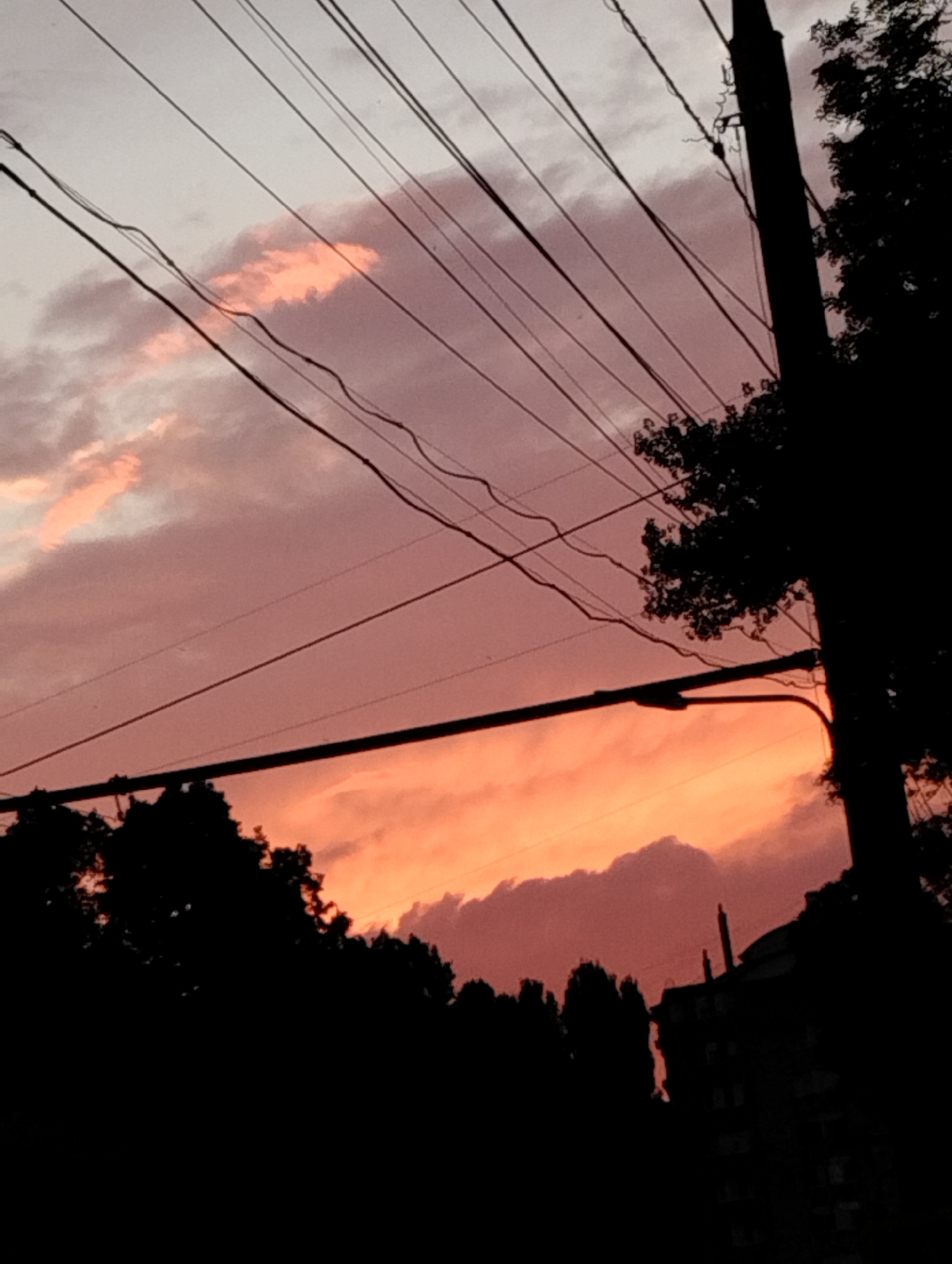 Chișinău streets under a vivid summer sunset sky