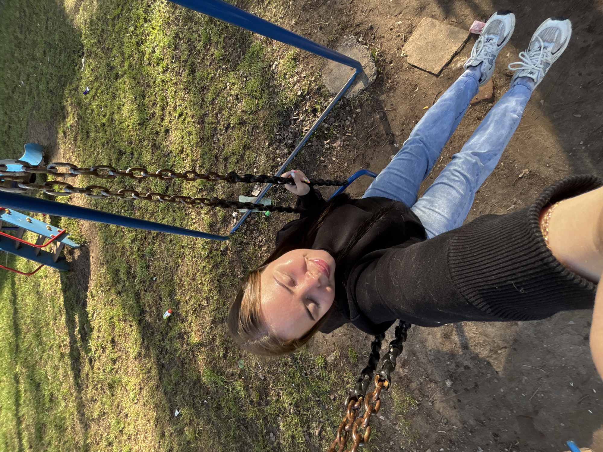 Woman observed at playground swing in Izhevsk early morning