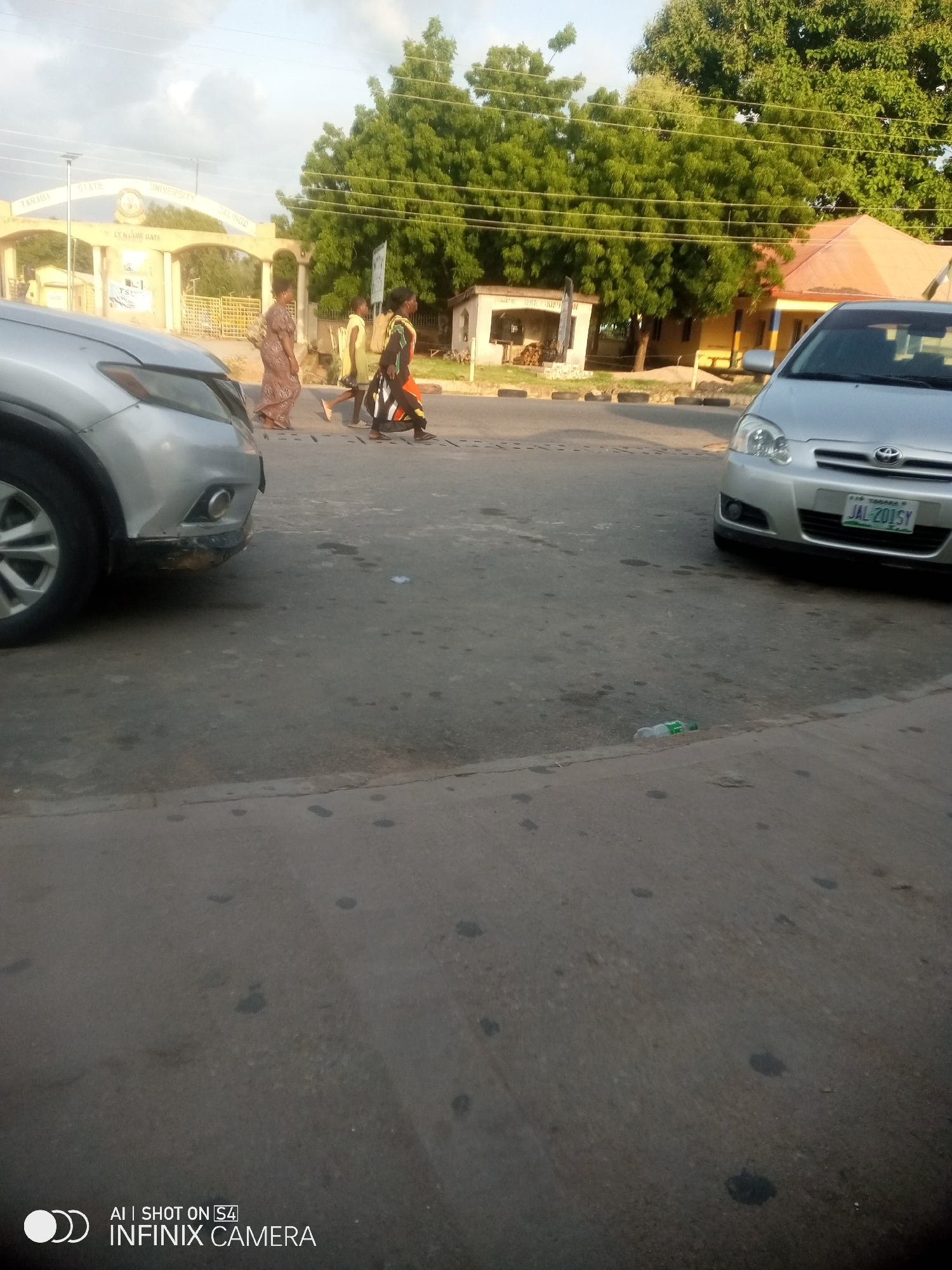 Roadside life outside Taraba State University, Jalingo, late afternoon