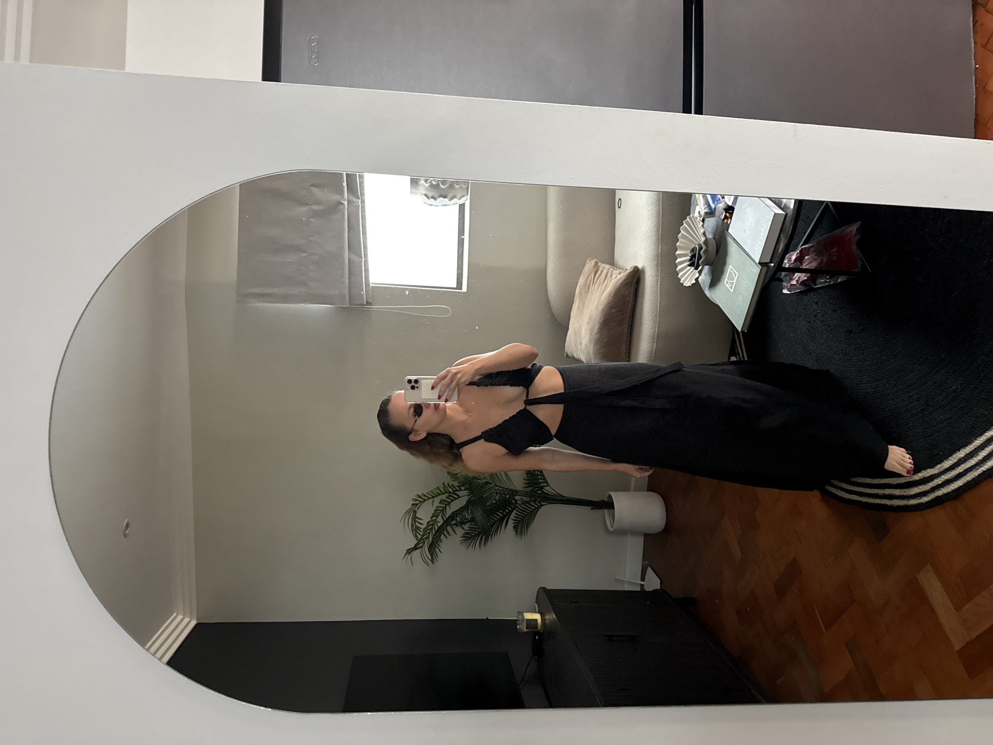 Woman takes mirror selfie in Cape Town home setting