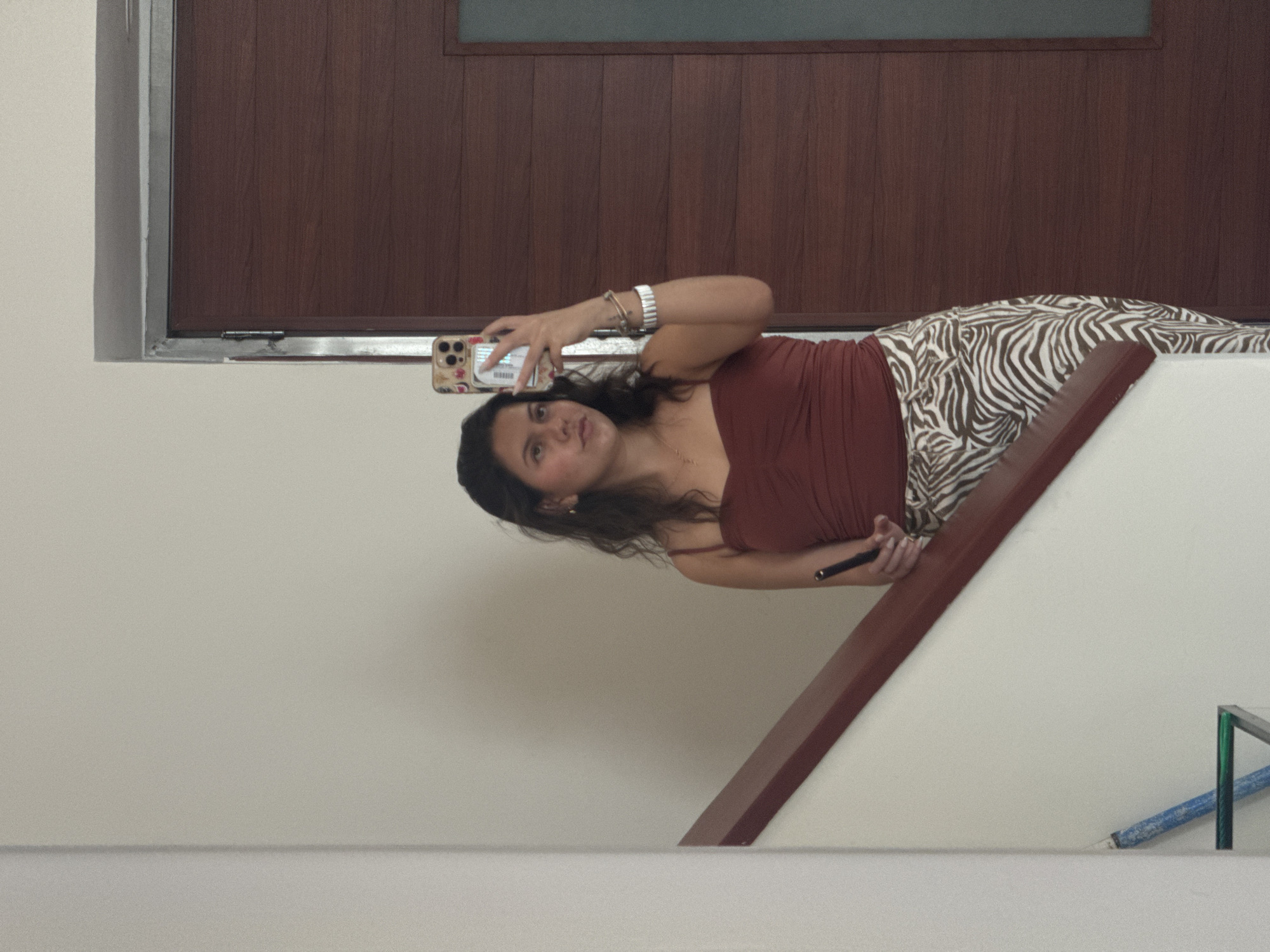 Woman Takes Selfies in Puebla Stairwell