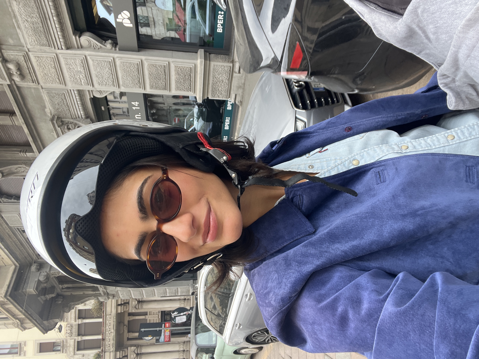 Woman takes helmet selfies in Milan