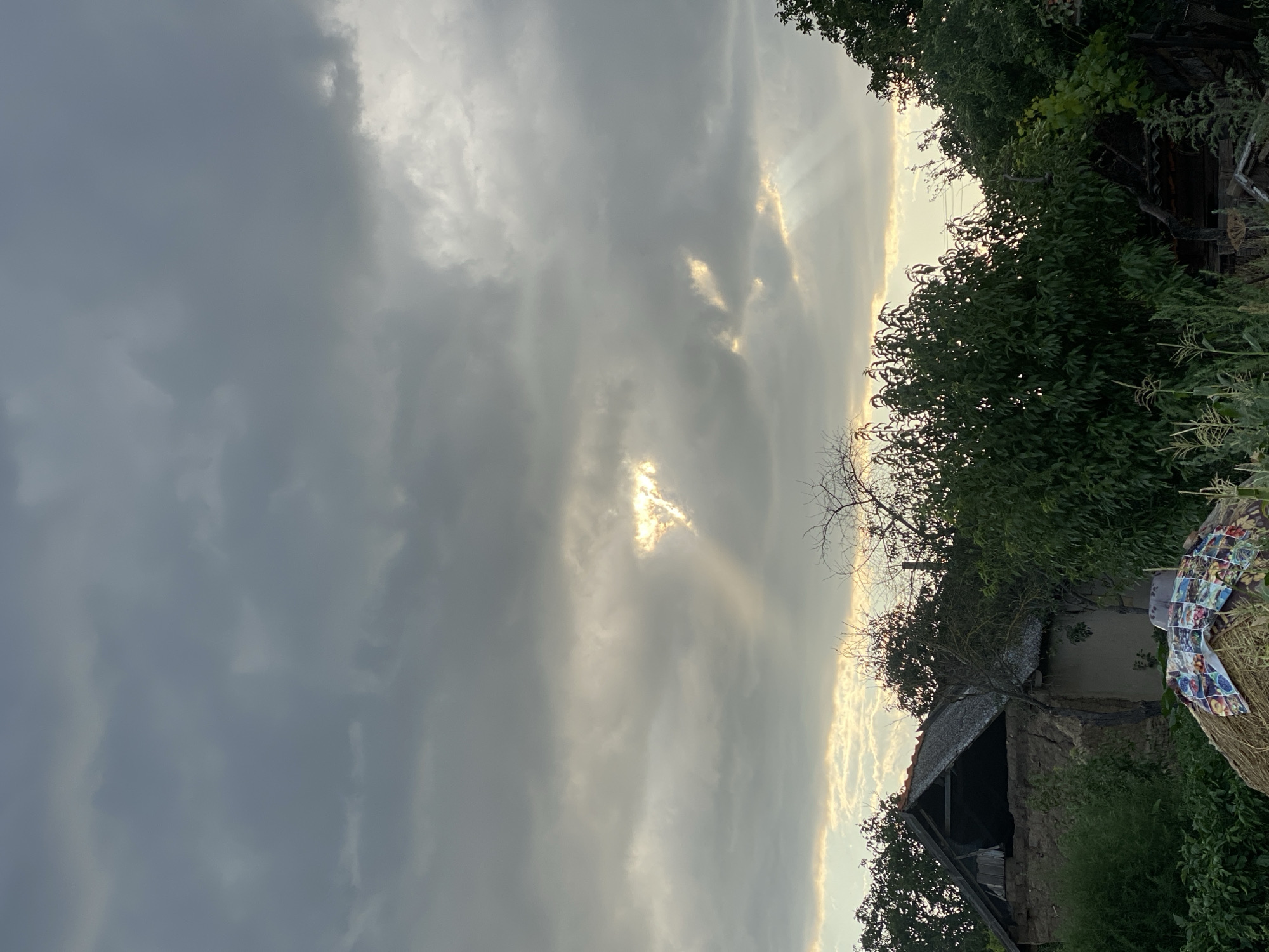 Storm clouds give way to a fiery sunset over rural Moldova
