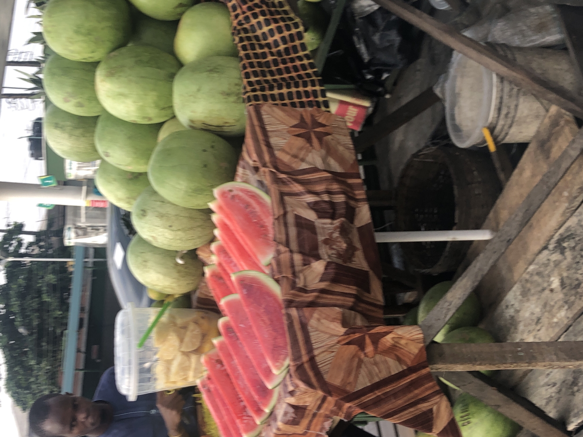 Street market life in Lagos, seen from auto-rickshaws