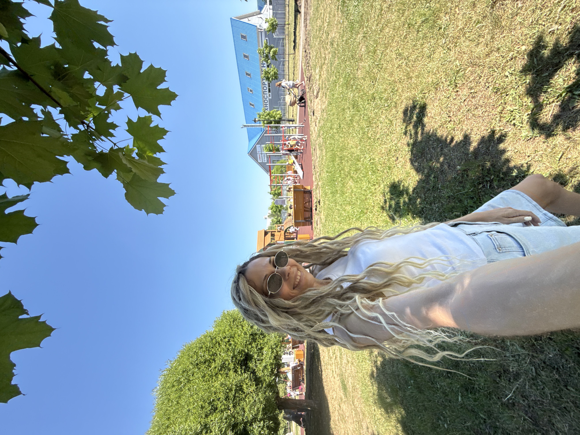 Woman and child enjoy morning at amusement park