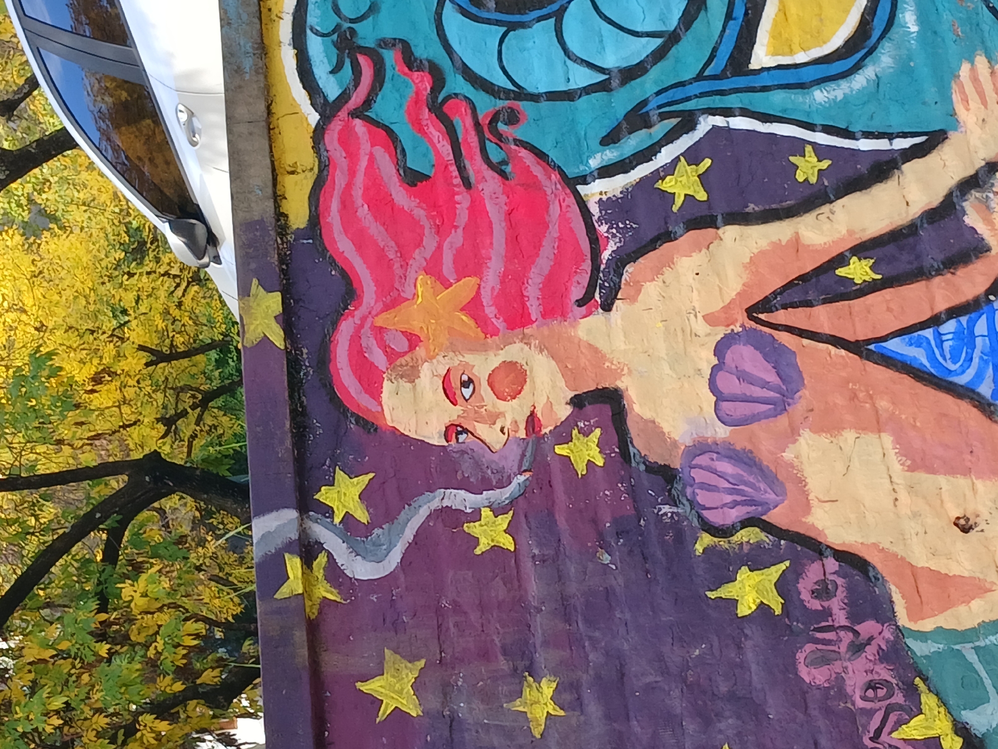 Buenos Aires street walk captures mermaid murals and bakery displays