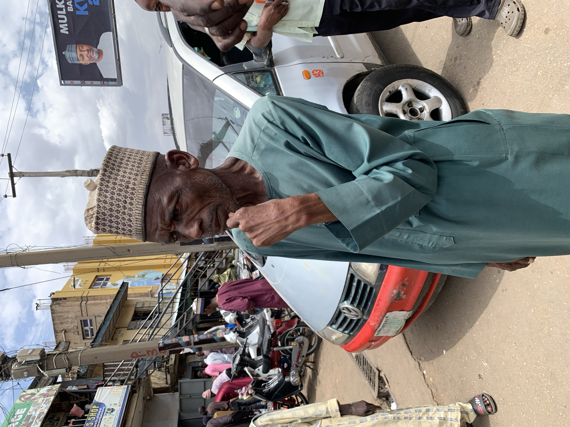 Daily life unfolds on Jos streets during midday hour