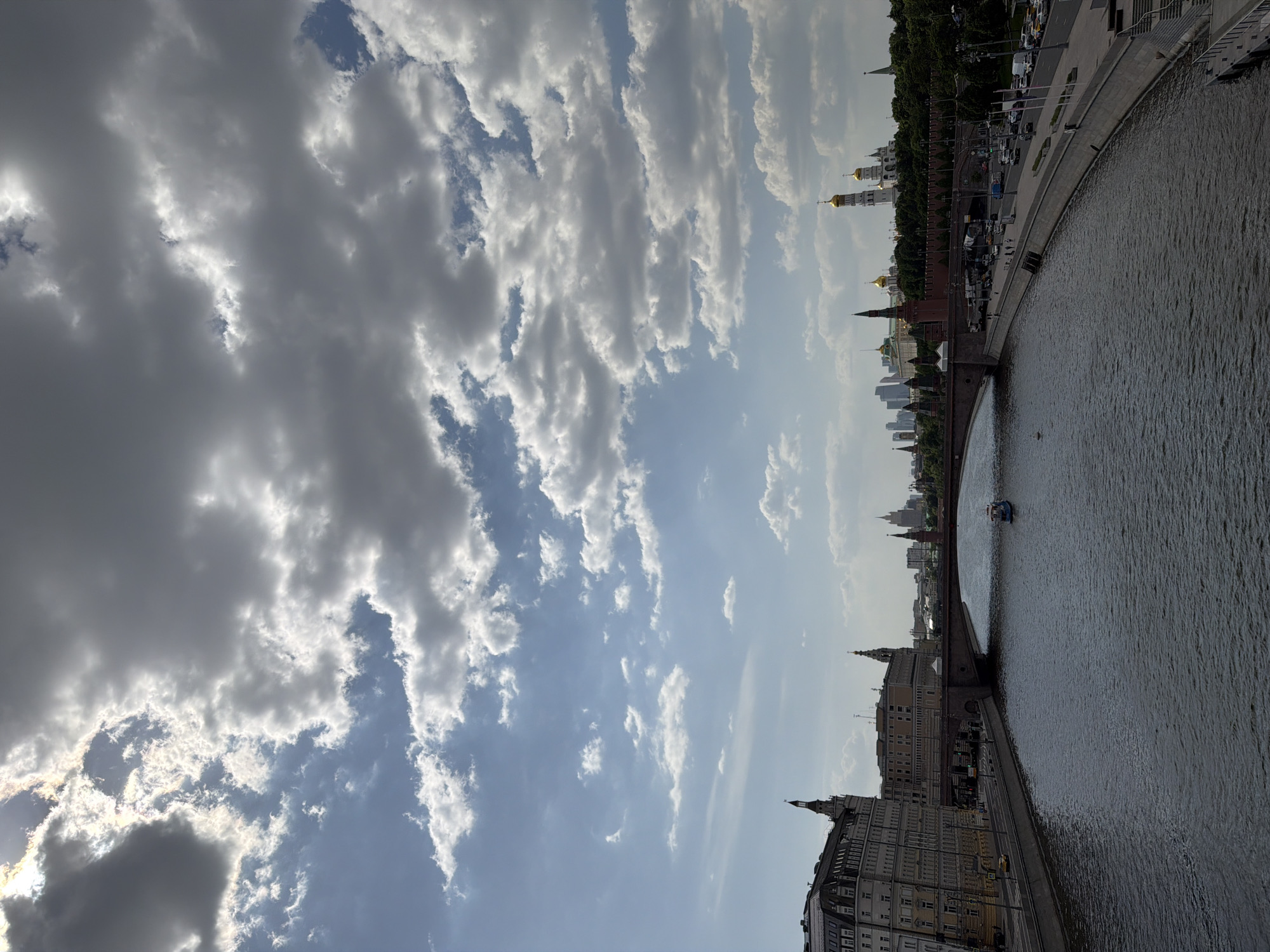 Moscow riverfront scene captured showing Kremlin and boat traffic