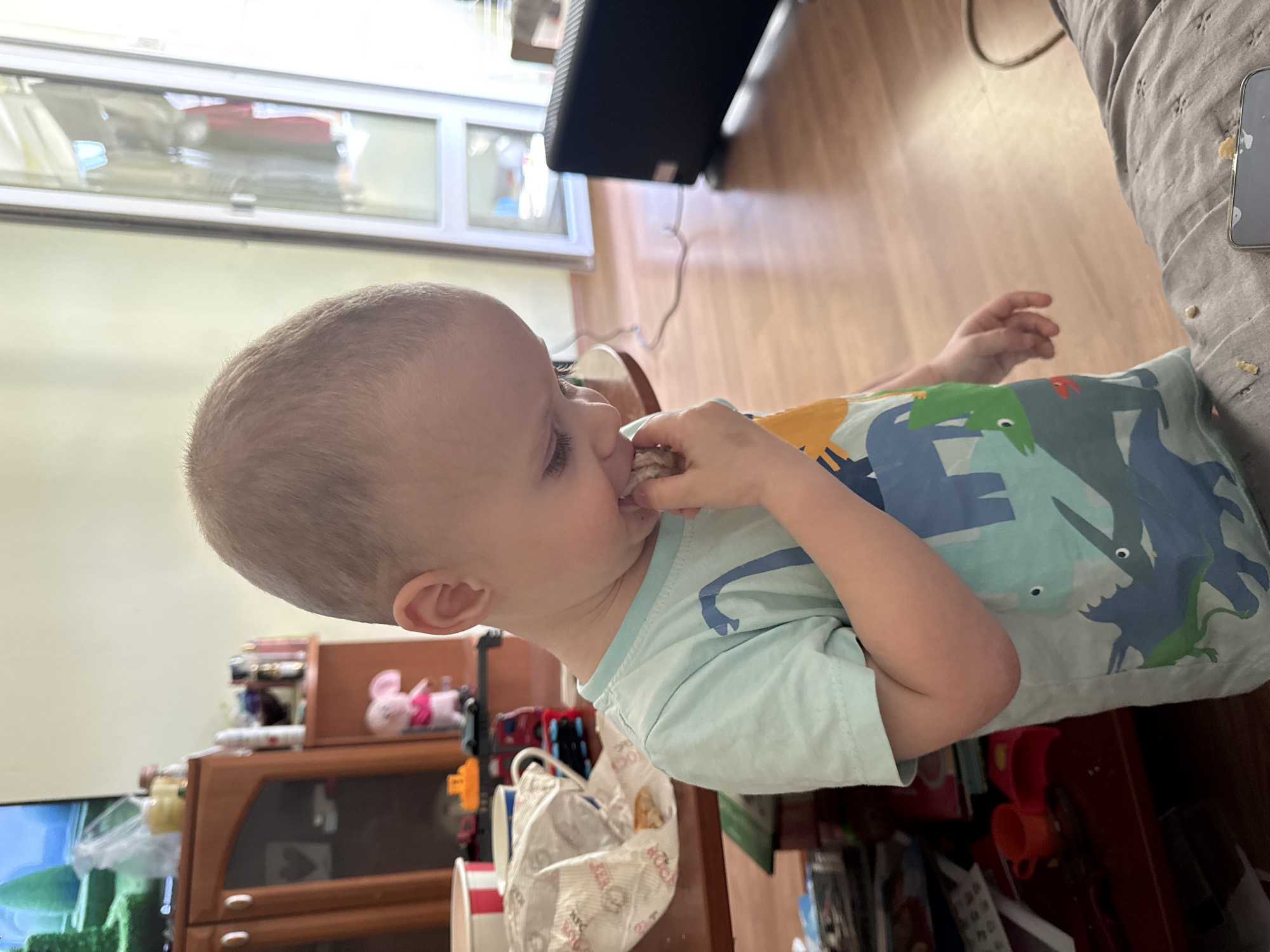 Toddler enjoys snack time at home in Sofia