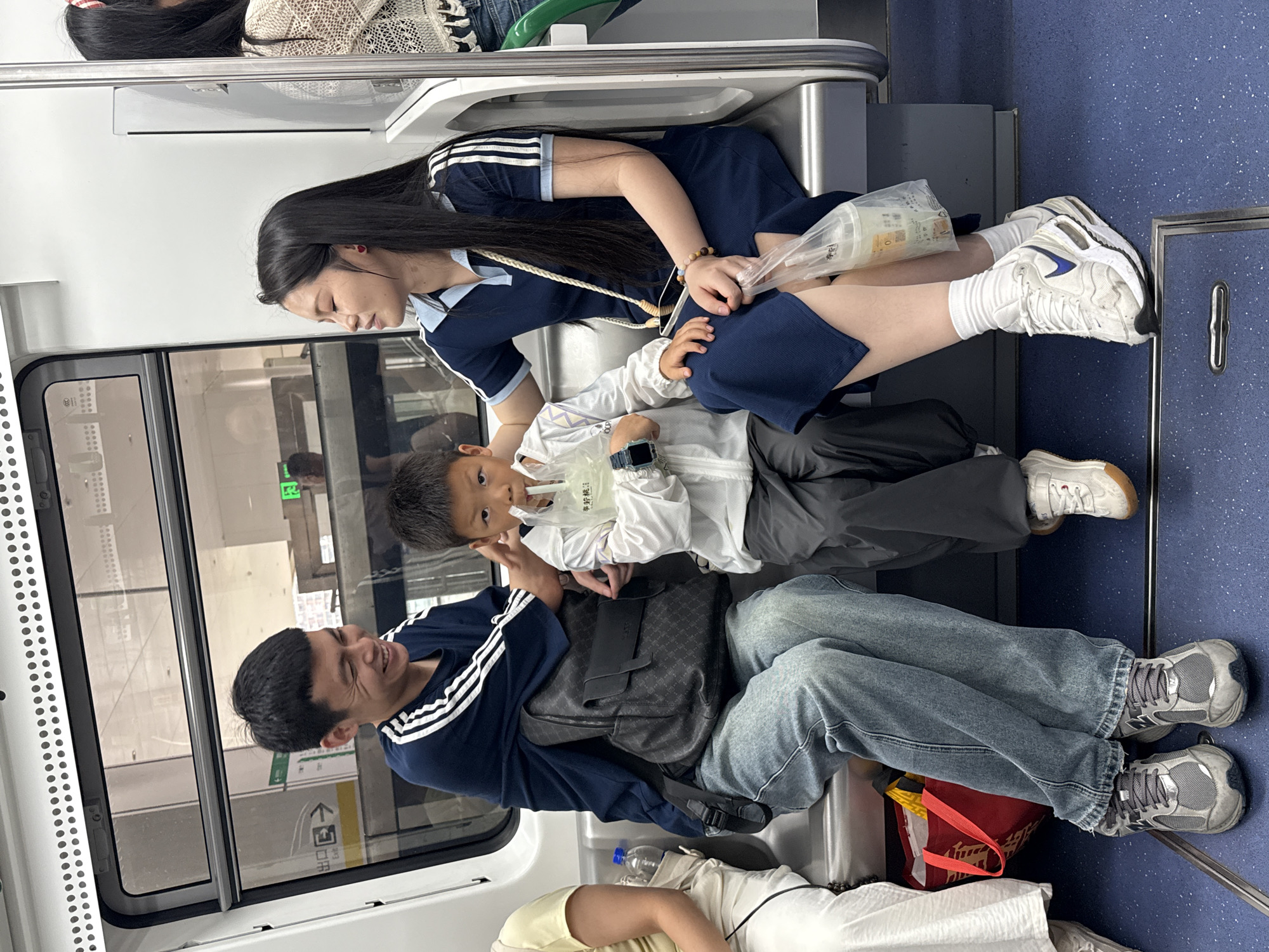 Three passengers ride subway train in Longta, China